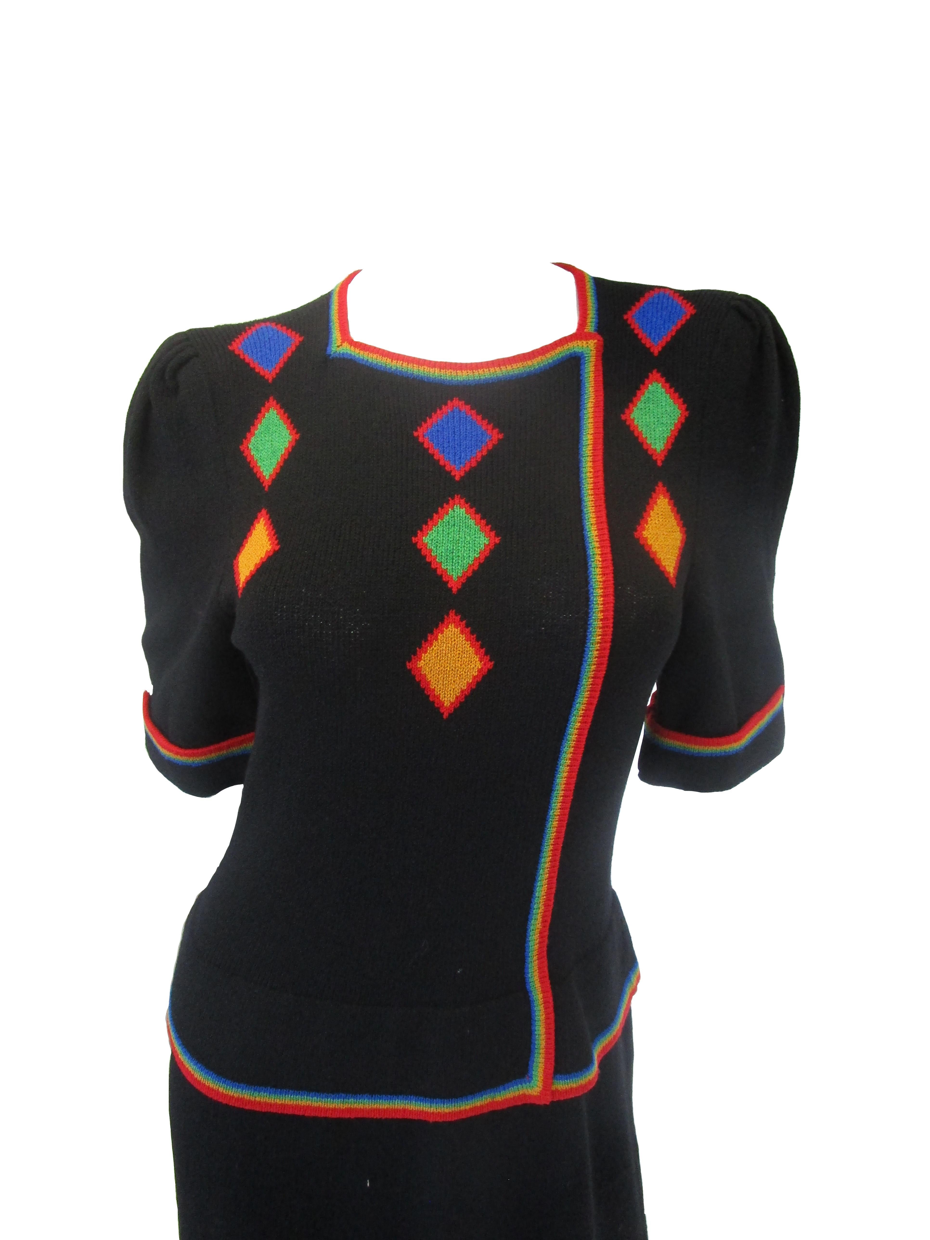 Easy, stylish and versatile knit dress from Adolfo! It features a two in one top and skirt with zipper closure, contrast rainbow details. The skirt falls just at knee length , the sleeves rest at elbow length and are slightly gathered at the