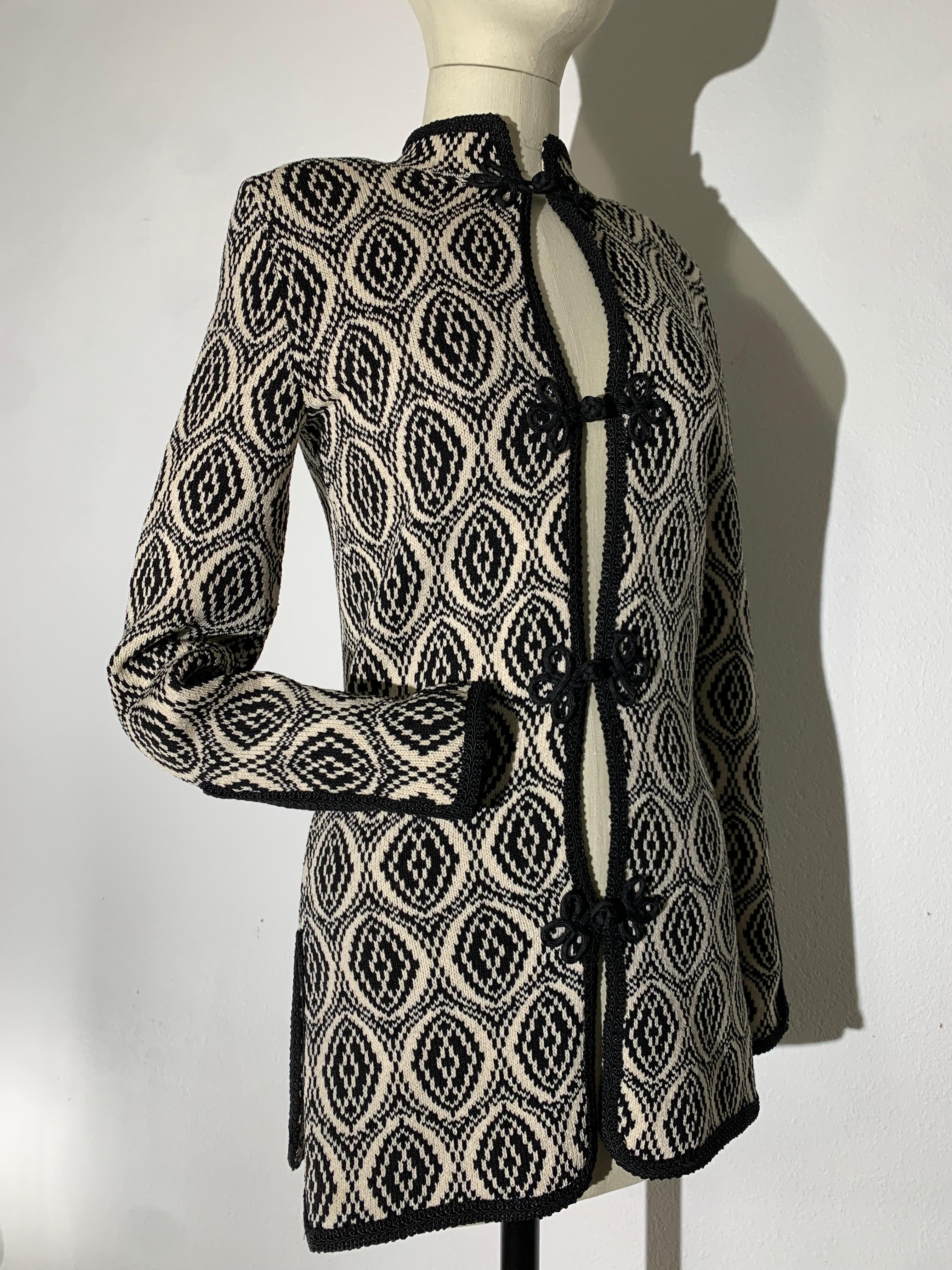 1970s Adolfo Black/White Arabesque Pattern Knit Tunic Jacket w Frog Closures: Banded Collar. Unlined. Side vents. Black knit piping at edges and cuffs. US size Small. 