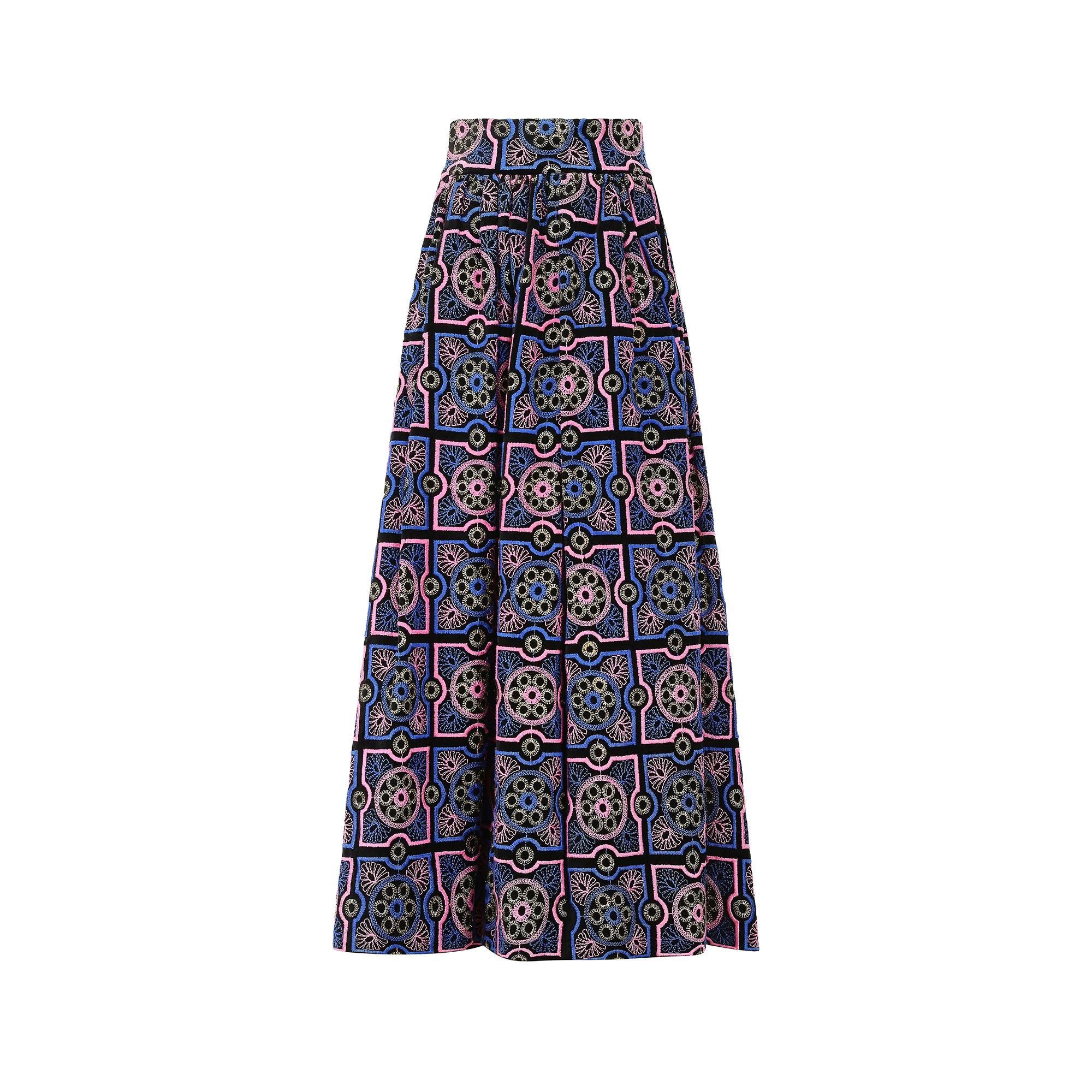 This exceptional, circa 1970, Adolfo Sardina black velvet embroidered maxi skirt is in excellent archival condition and ready to be worn for any statement occasion. It is expertly embroidered with luxurious pink, blue and gold threads that create a