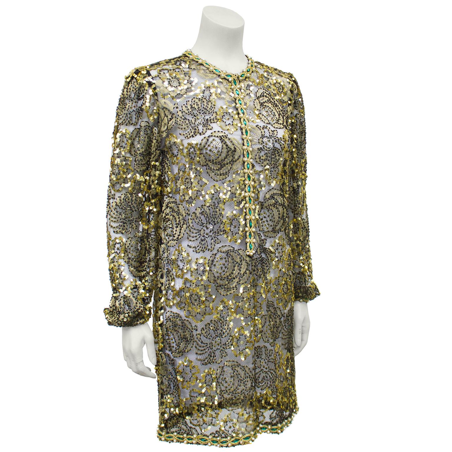 Exquisite Adolfo gold lace beaded evening tunic from the 1970s. Beautifully detailed with gold sequin applique throughout and faux pearl, emerald marquis bead and gold thread trim along the collar, front placket, cuffs and hem. Fastens with a hidden