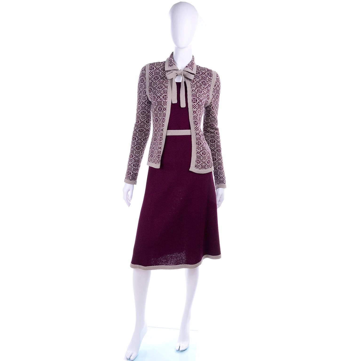 This is a fabulous Adolfo vintage ensemble that includes a 2 piece dress with a sleeveless burgundy knit tank and skirt, and an open front burgundy and tan print cardigan sweater jacket that closes with a bow at the neck.  We love Adolfo and really