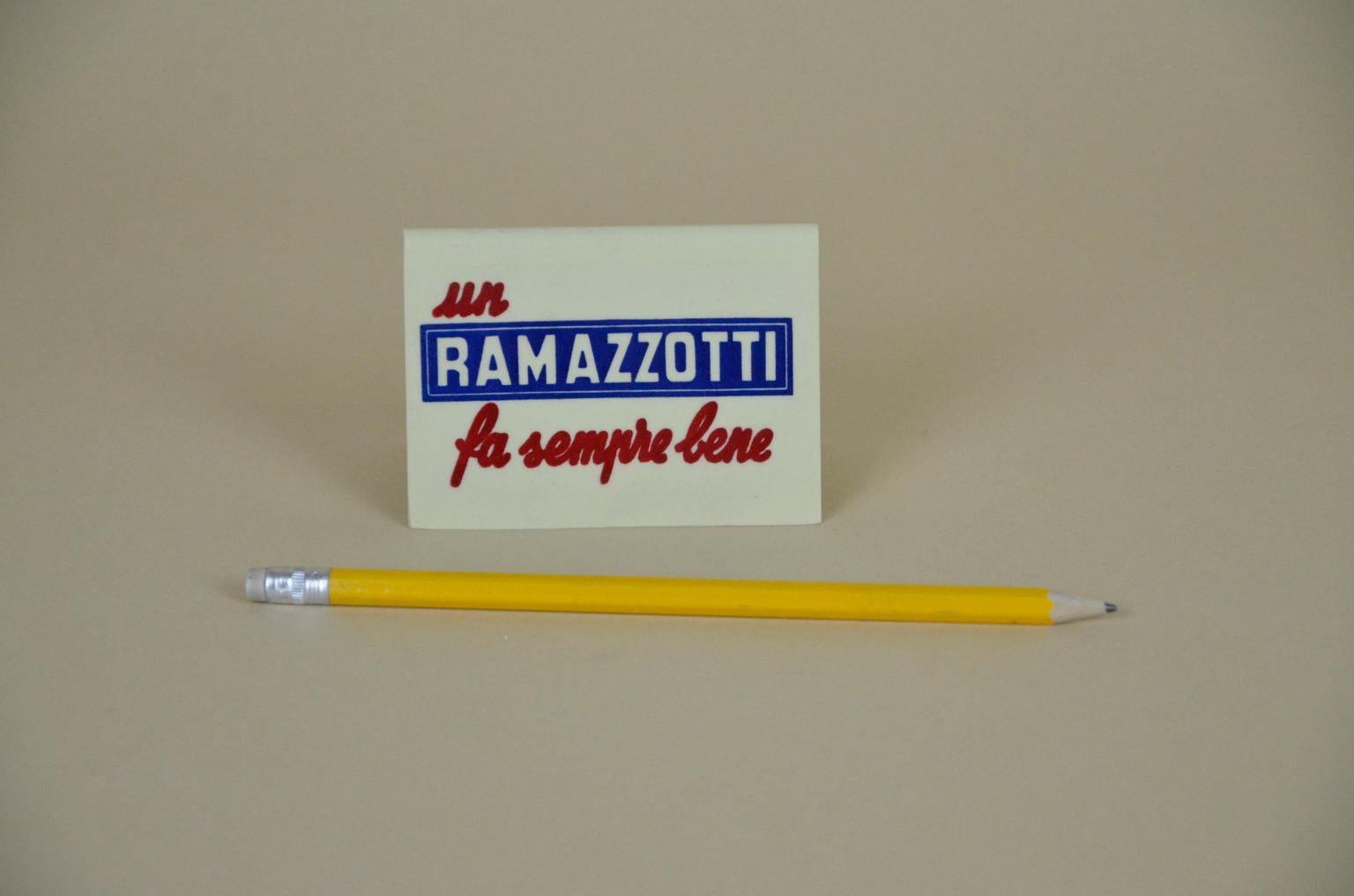 1970s advertising vintage Italian Ramazzotti plastic place card holder.

On one side the Ramazzotti corporate motto 