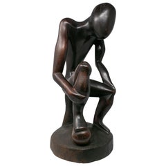 1970s African Hand Carved Wooden Sculpture of Sitting Man