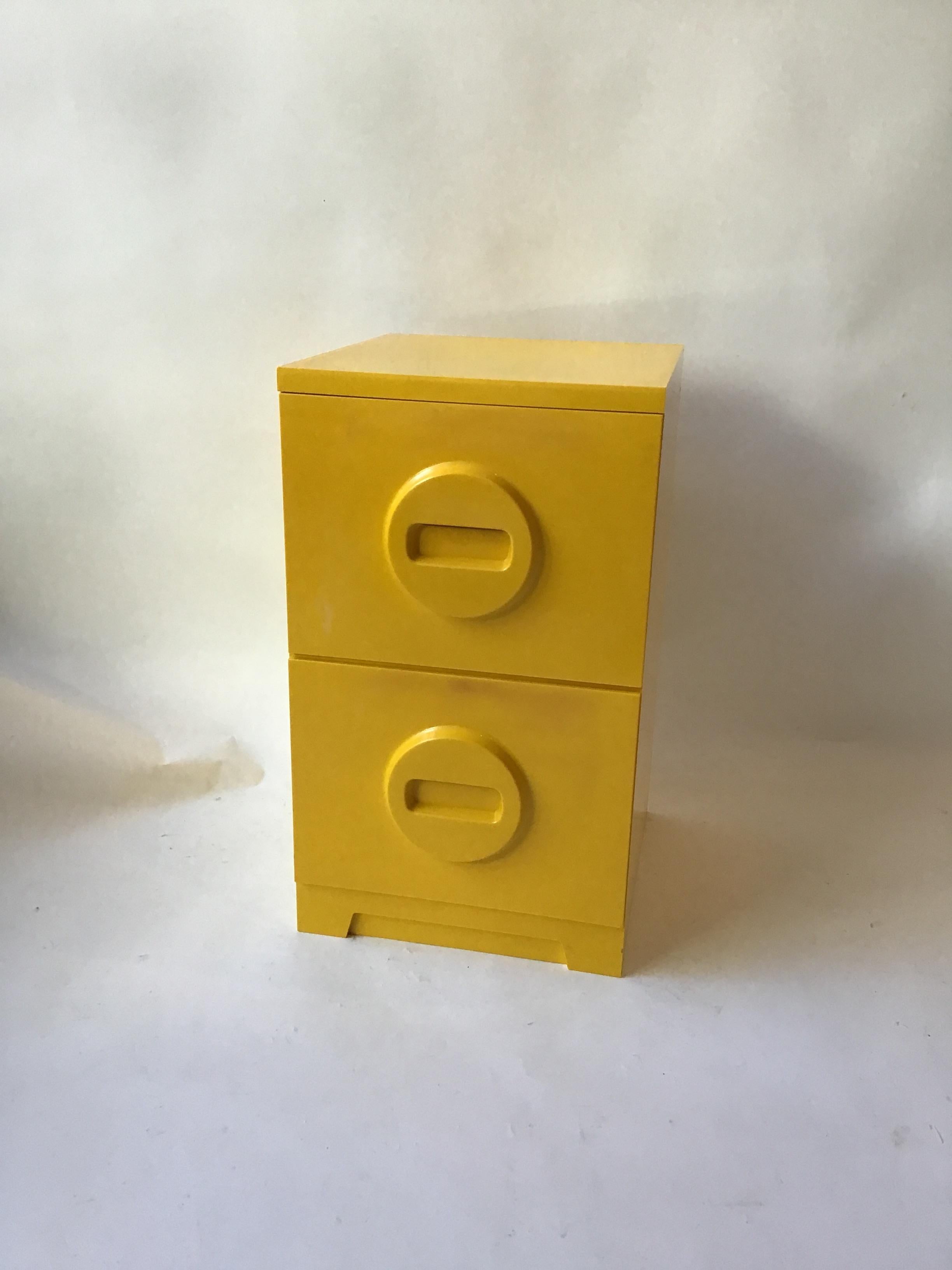 1970s Akro-Mils yellow plastic file cabinet.