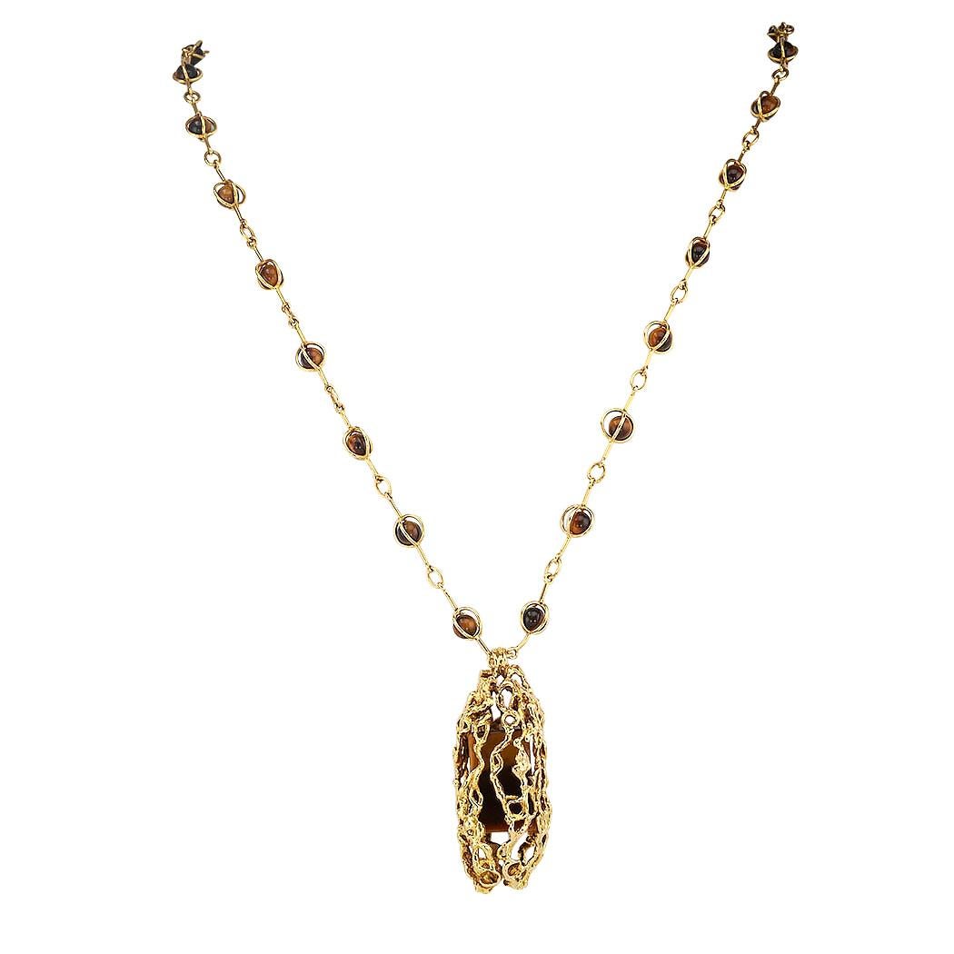 Alan Gard tiger eye and yellow gold handcrafted pendant necklace circa 1971.  *(See special note below.)  Love it because it caught your eye, and we are here to connect you with beautiful and affordable jewelry.  Decorate Yourself!  Simple and