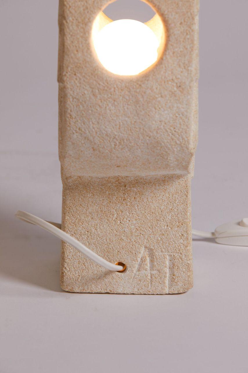 Albert Tormos French hand carved limestone sculptural table lamp, circa 1970. By Vallauris artist Tormos in St. Tropez. One single light bulb source in the interior.