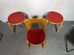 1970s Alvar Aalto stools and childs chair. birch & red laminate tops.