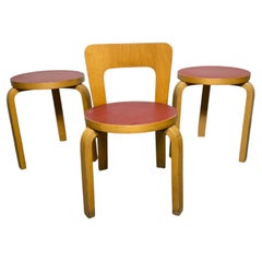 1970s Alvar Aalto stools and childs chair. birch & red laminate tops.