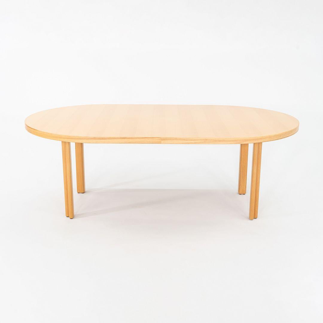 This is a H-Leg Extension Dining Table, originally designed by Alvar & Aino Aalto in 1956. This particular example was produced by Artek in Finland dates to the 1970s. The piece is comprised of beech. 
 
 The table measures 50 inches deep, 84 inches