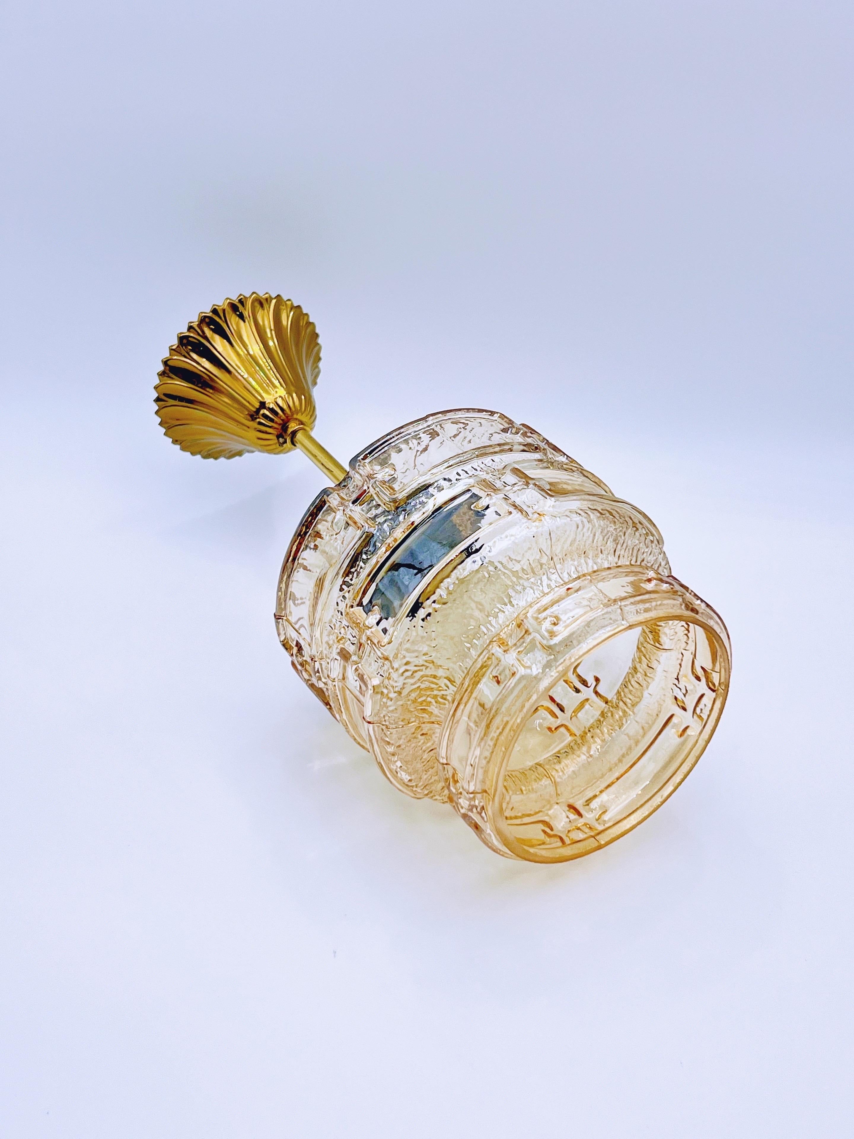 European 1970s Amber glass & brass pendant light For Sale