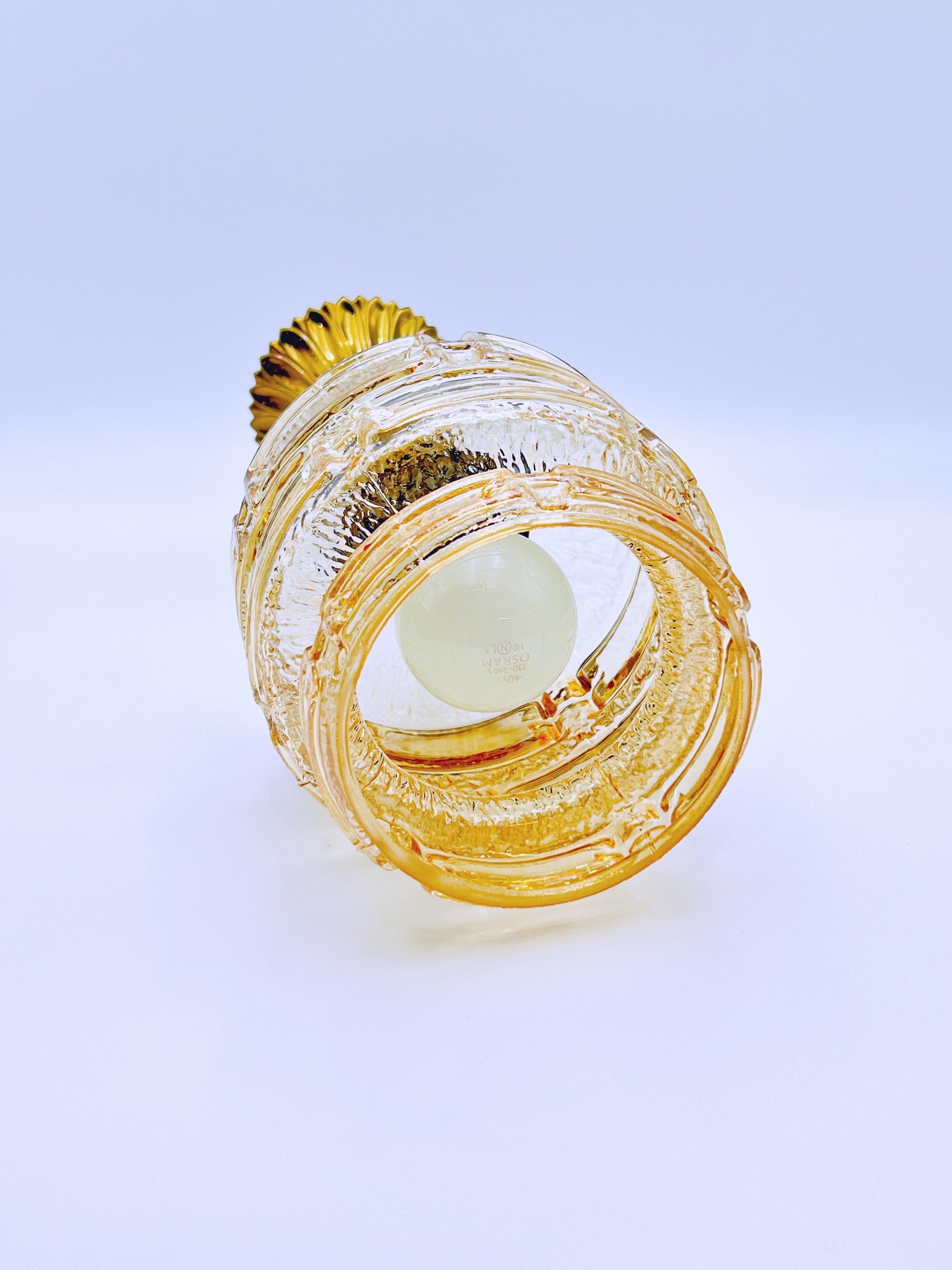 Metal 1970s Amber glass & brass pendant light For Sale
