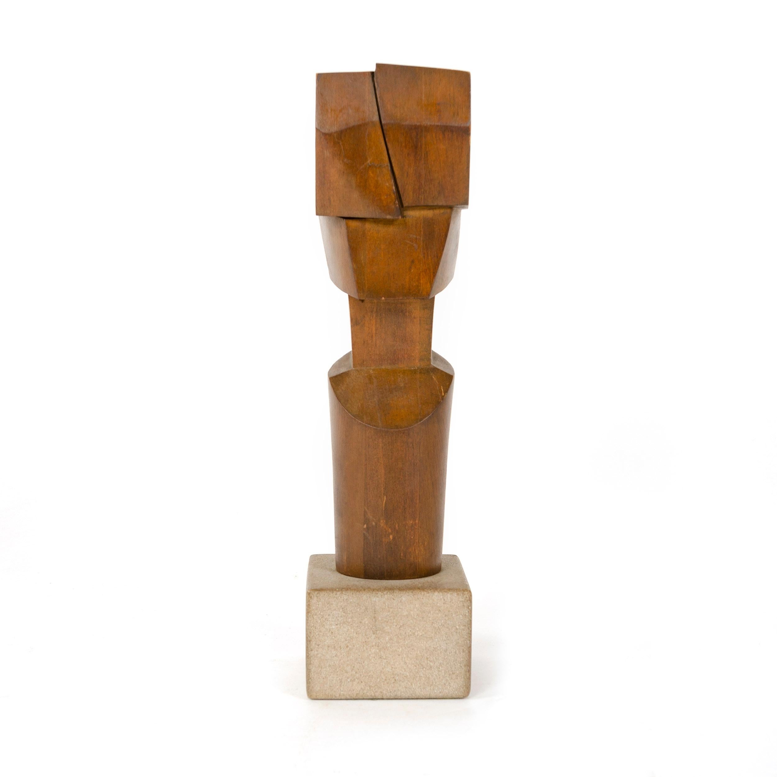 A modernist pine sculptural bust in the manner of Cubism, set upon a concrete cube base. Signed 'W. Sildar'.
       