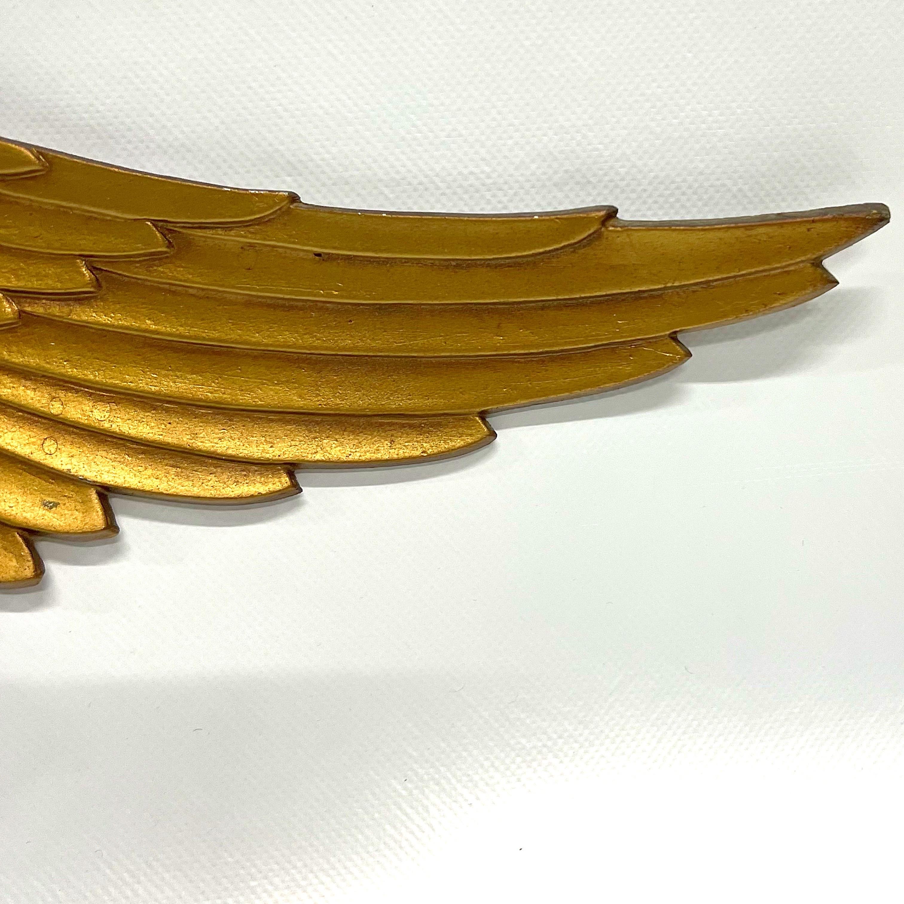 A nicely colored 1960’s patriotic American Bald Eagle caste iron wall hanging.