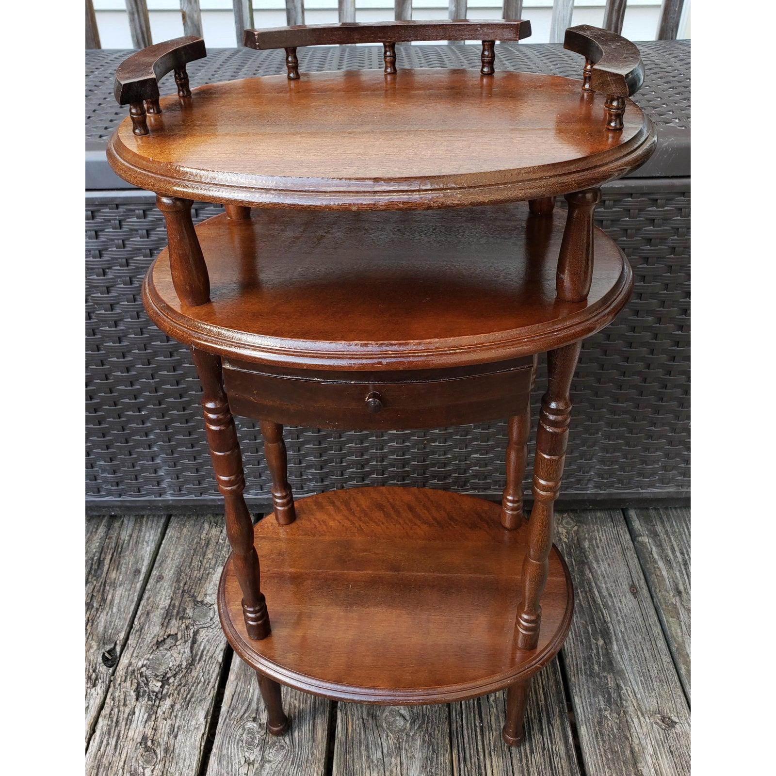 Solid walnut vintage three tier accent table, Side table, lamp table, end table. Table come with drawer in the middle tier, which is rare to come by. The Spindle legs and the table top balcony make this table a rare jewel to complement any room in