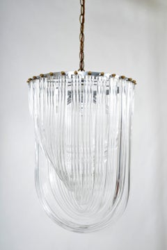 1970s American Lucite Acrylic Ribbon and Brass Chandelier Hollywood Regency