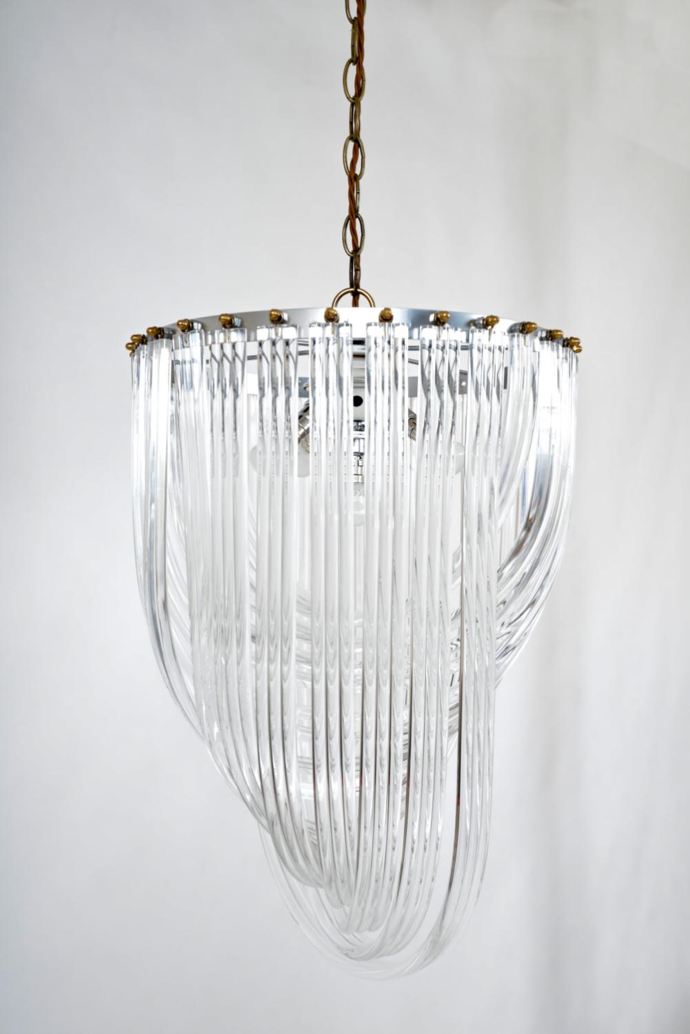Metal 1970s American Lucite Acrylic Ribbon and Brass Chandelier Hollywood Regency  For Sale