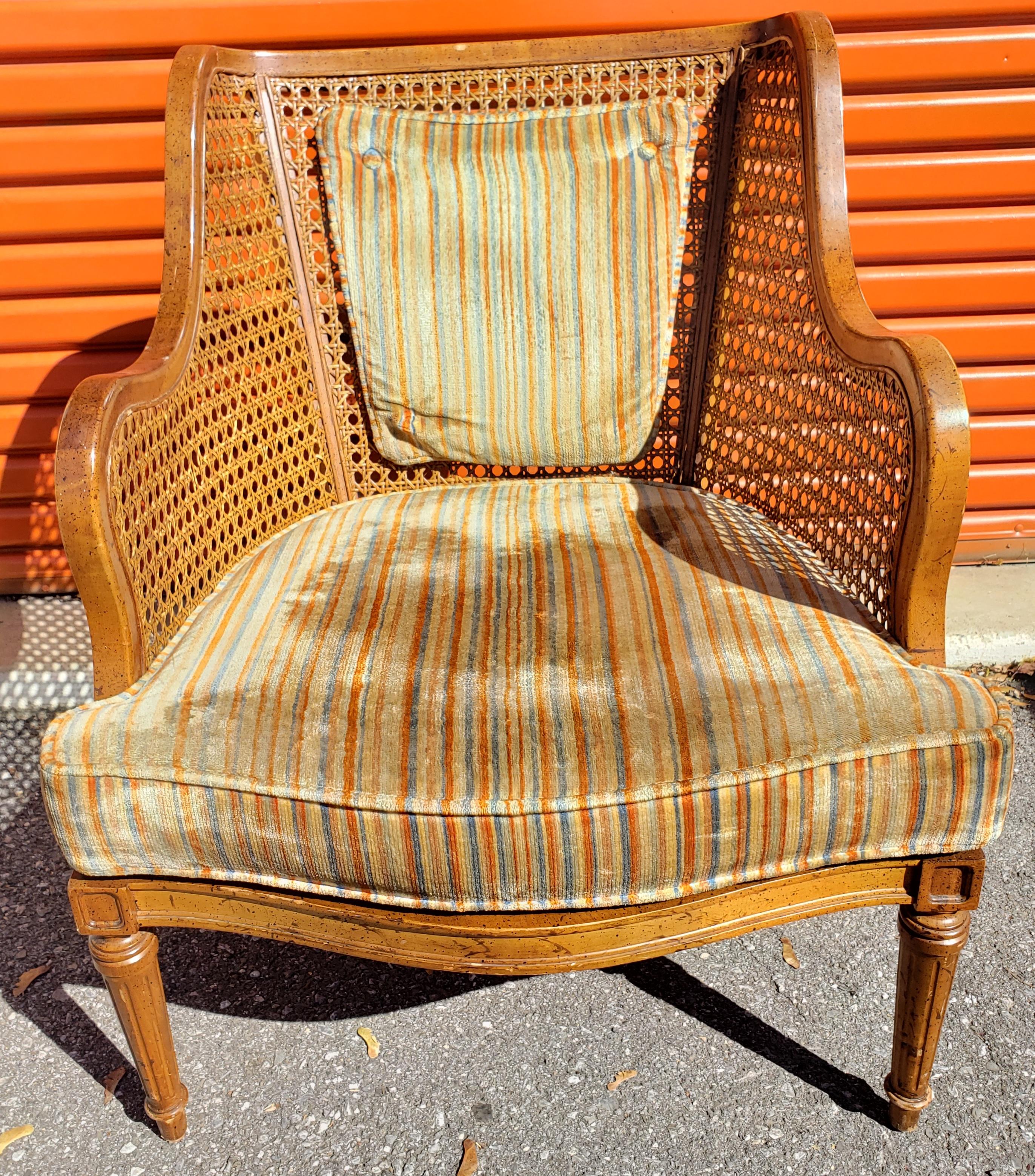 For your consideration is American of Martinsville cane back chair with walnut wood frame and striped upholstery. Loose seat cushion.
Measures 26.5