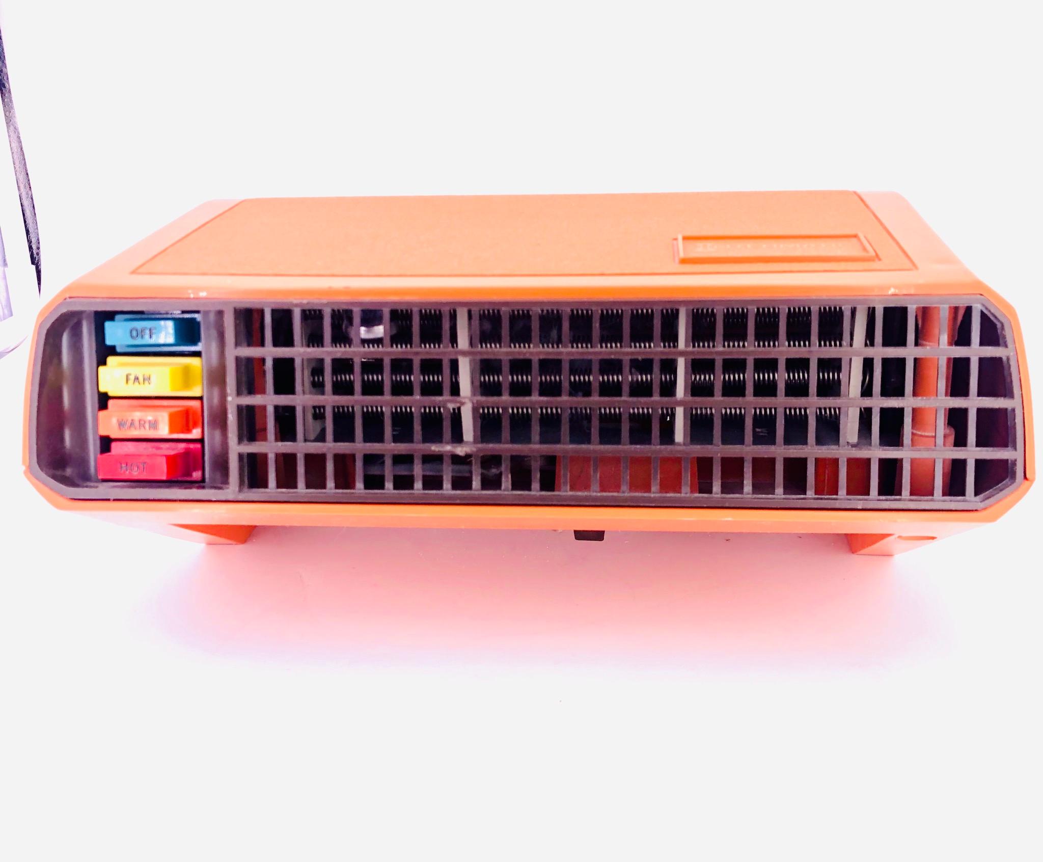 American Space Age design, on this cool portable heather by Intermatic heatwave in perfect condition very light use, with thermostat. Great orange color.