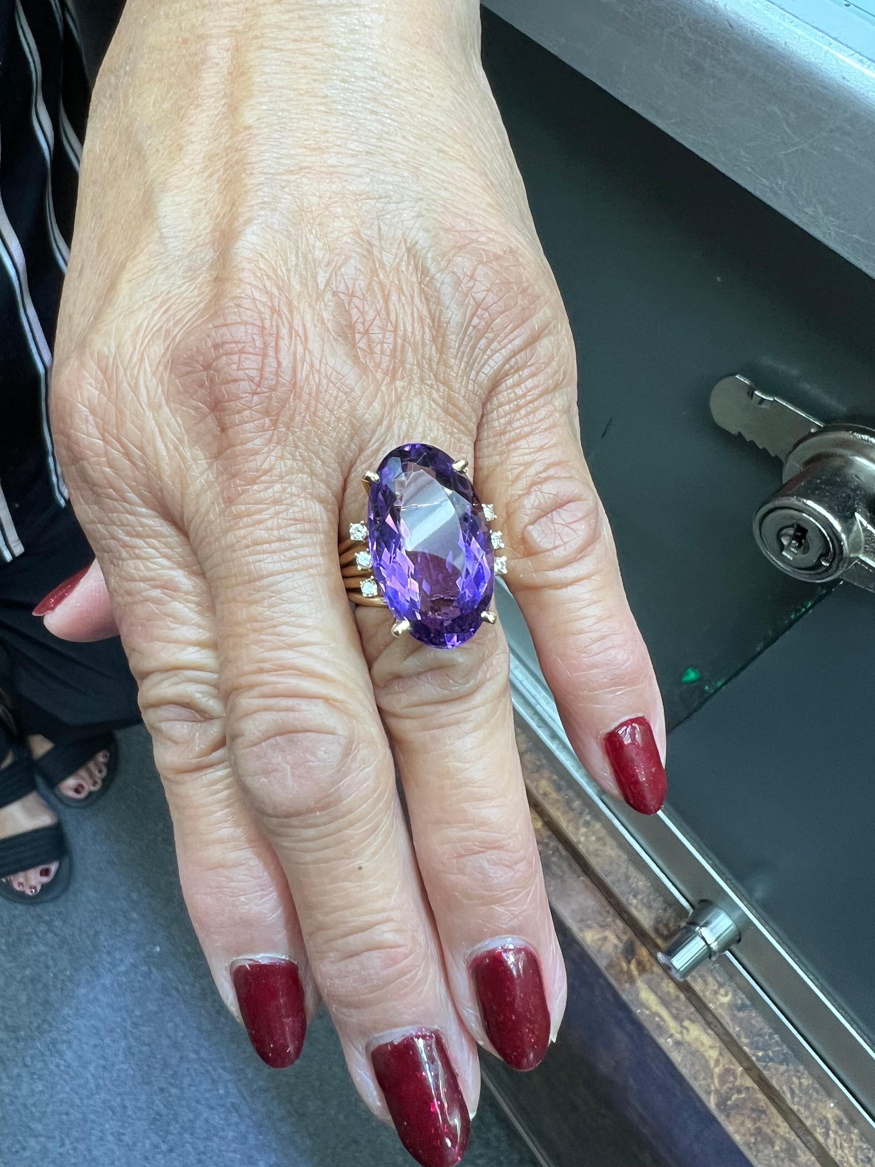 1970s Amethyst diamond yellow gold cocktail ring.

The 1970s amethyst diamond yellow gold cocktail ring exemplifies the era's distinctive approach to jewelry design, characterized by boldness and a flair for the dramatic. Cocktail rings gained