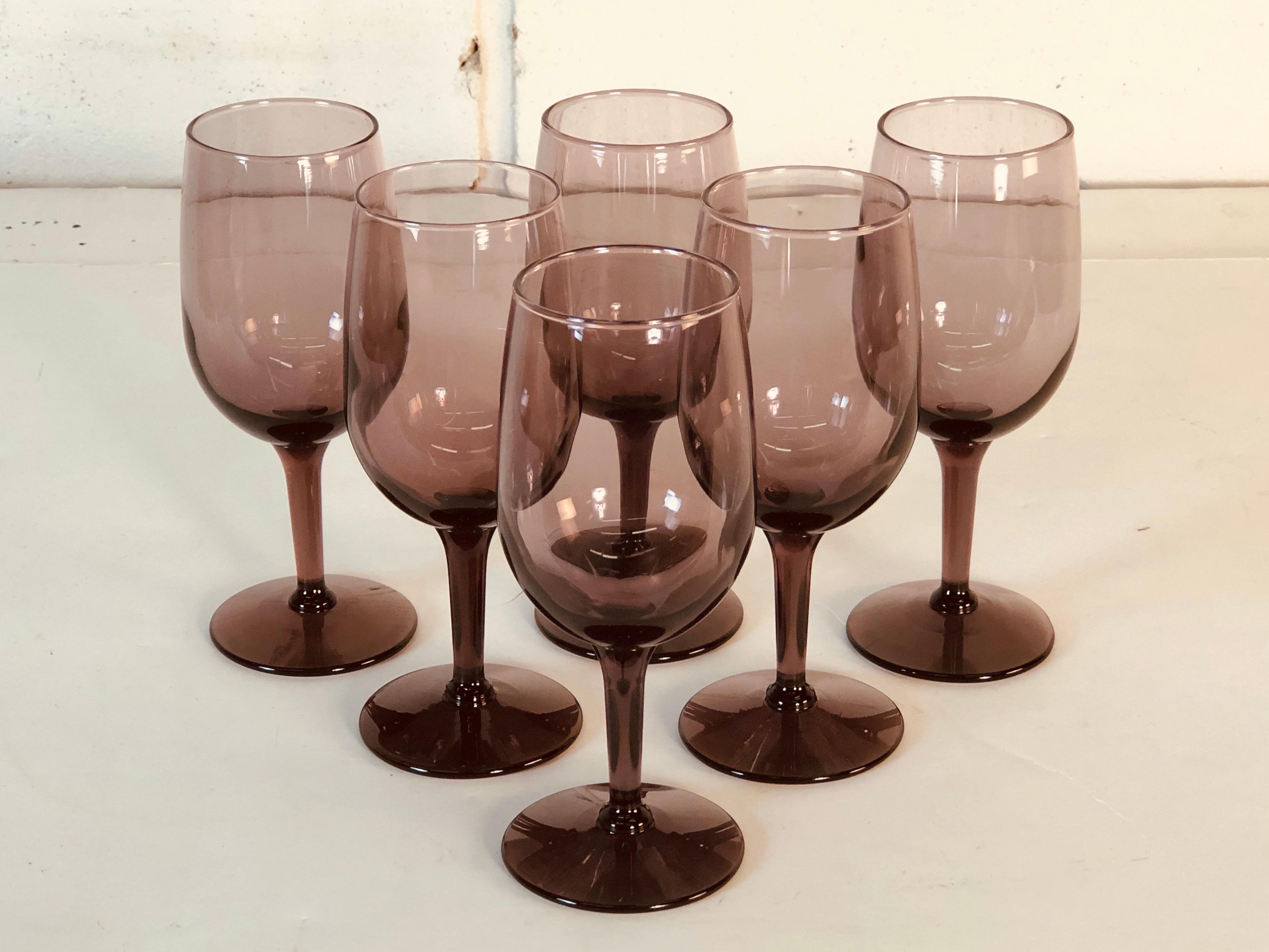 Vintage 1970s amethyst glass wine stems, set of six. No marks.
  