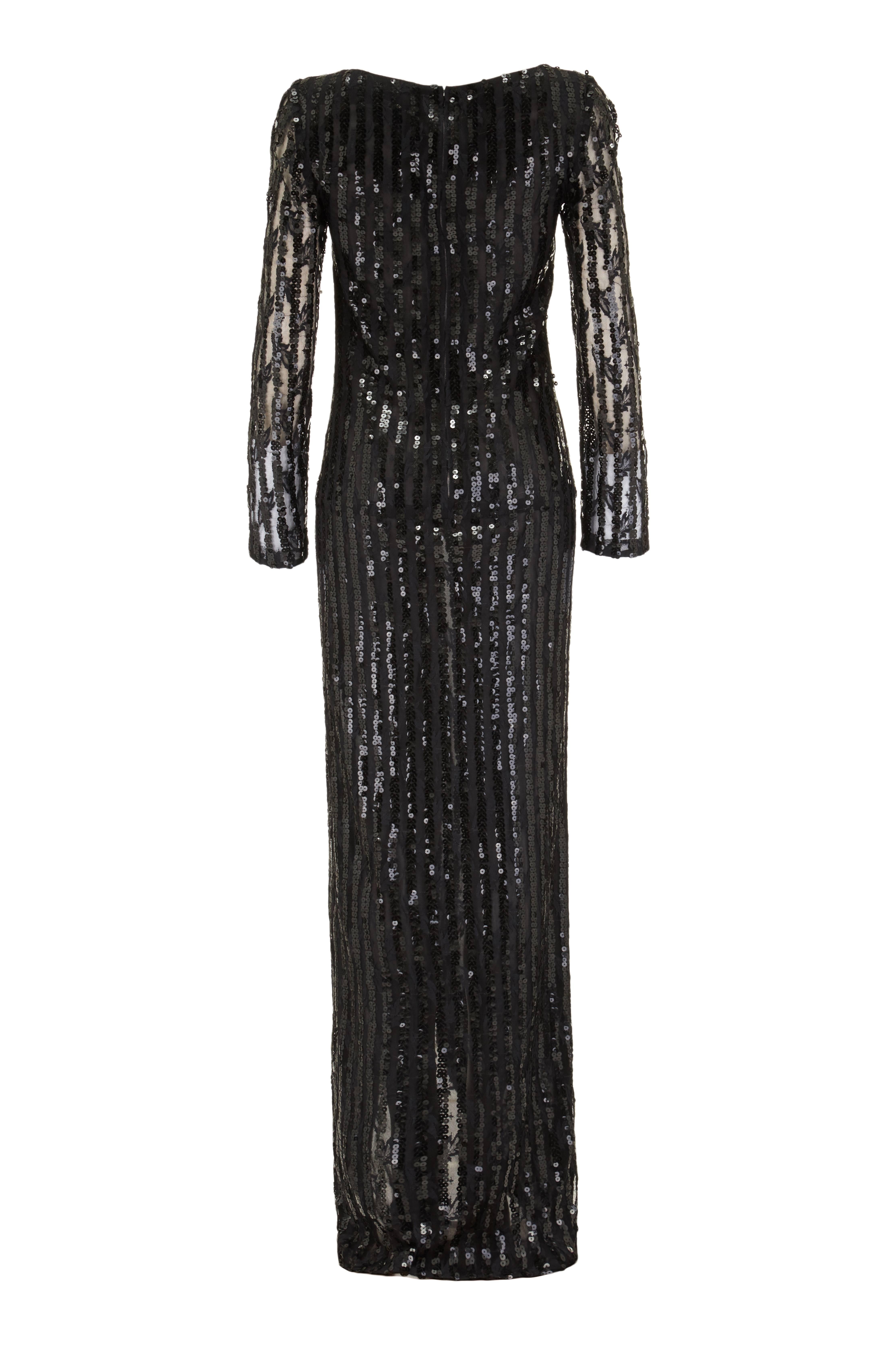This sensational full length black lace sequin evening dress from Italian design Andre Laug exudes glamour and is guaranteed to turn heads! This striking piece is made of a rayon lace net with vertical stripes of black sequins throughout. The main