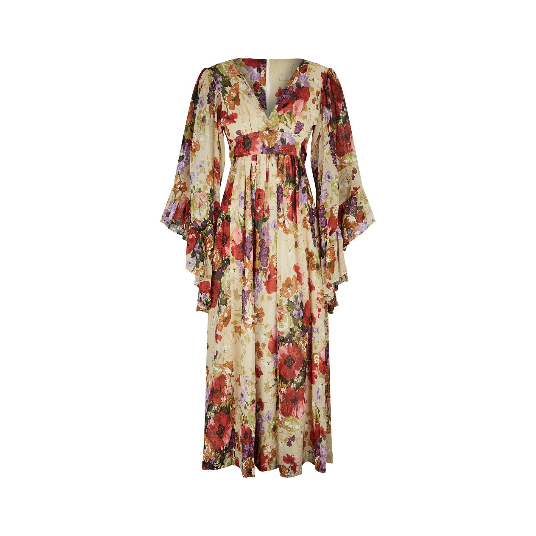 This is such a great print and the condition of this 1970s original angel sleeve dress is pristine.  Made from a lightweight gauze cotton, the dress has a painterly multi-coloured floral arrangement featuring an array of wild meadow flowers