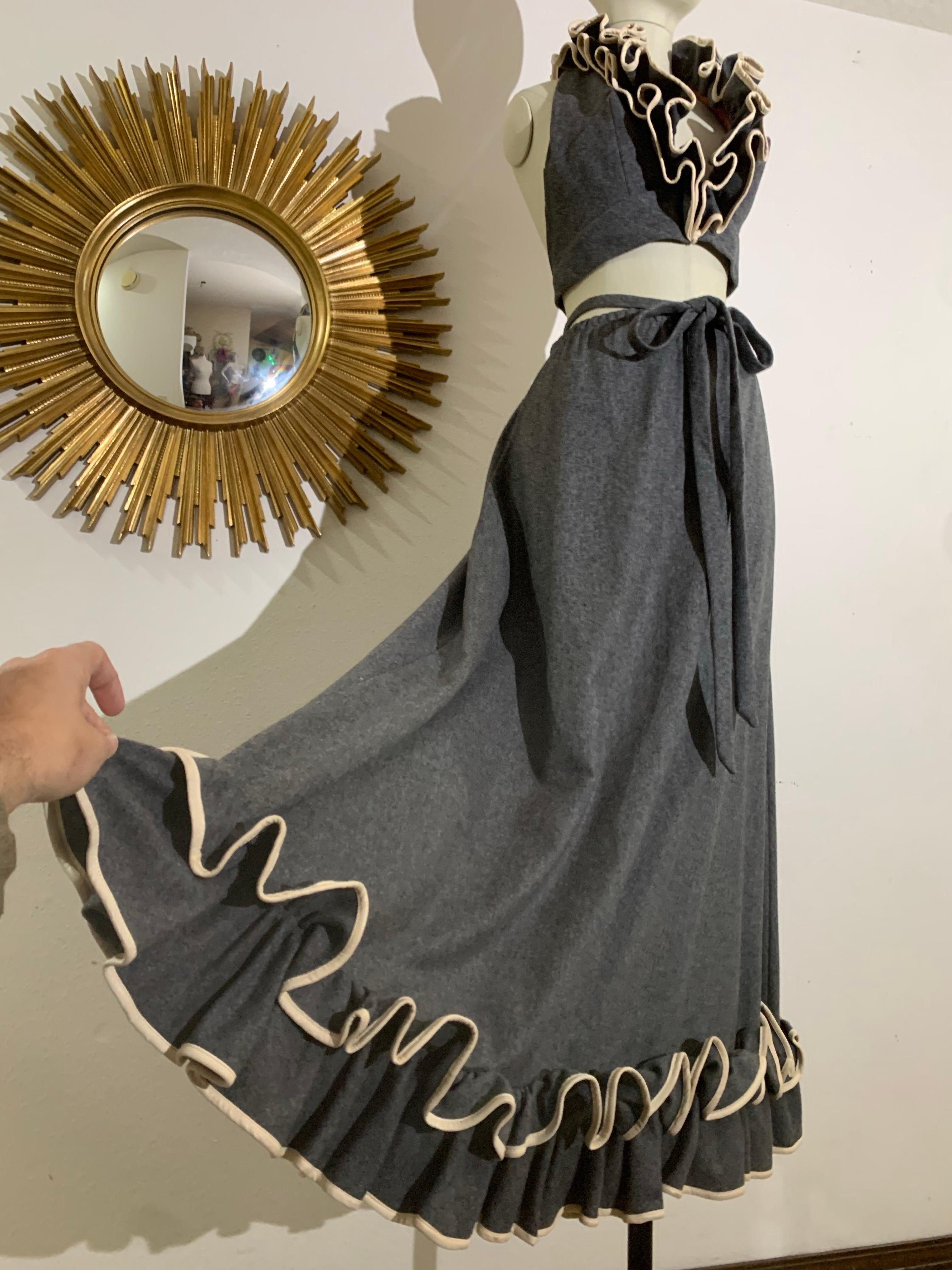 1970s Anne Fogarty Grey Wool Flannel Ruffled Halter Crop Top & Maxi Skirt:  Anne Fogarty uses her trademark flannel  in this unusual pairing with white vinyl piping on extravagant deep ruffles at neckline and hem. Halter top slips over the head with