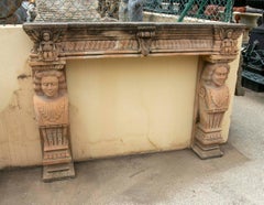 1970s Antique Stone Fireplace with Carved Carvings, Caryatids, and Cherubs