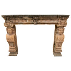 1970s Antique Stone Fireplace with Carved Carvings, Caryatids, and Cherubs