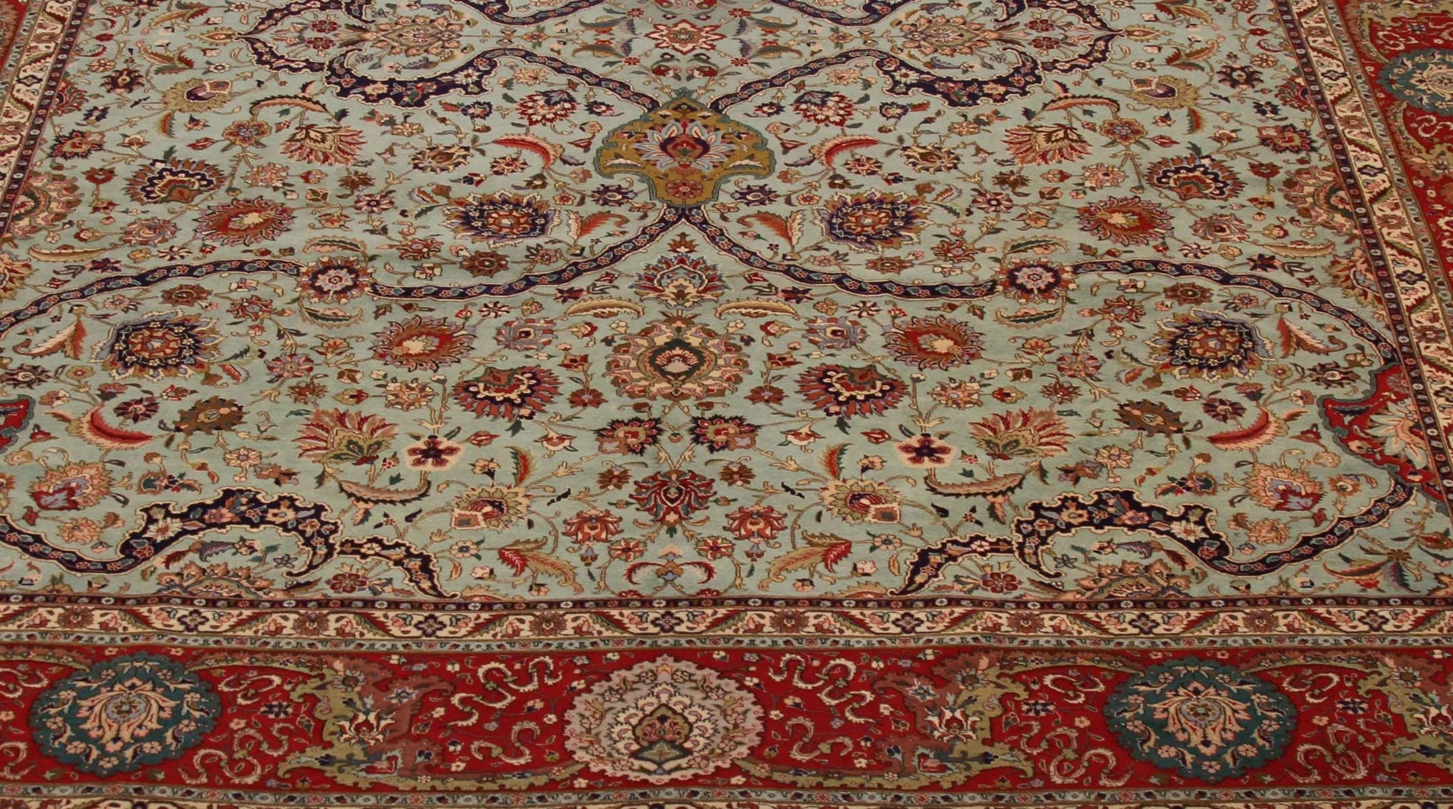 1970s Antique Tabriz Persian Rug with a Grand Blue and Red Floral Design In Excellent Condition For Sale In Dallas, TX
