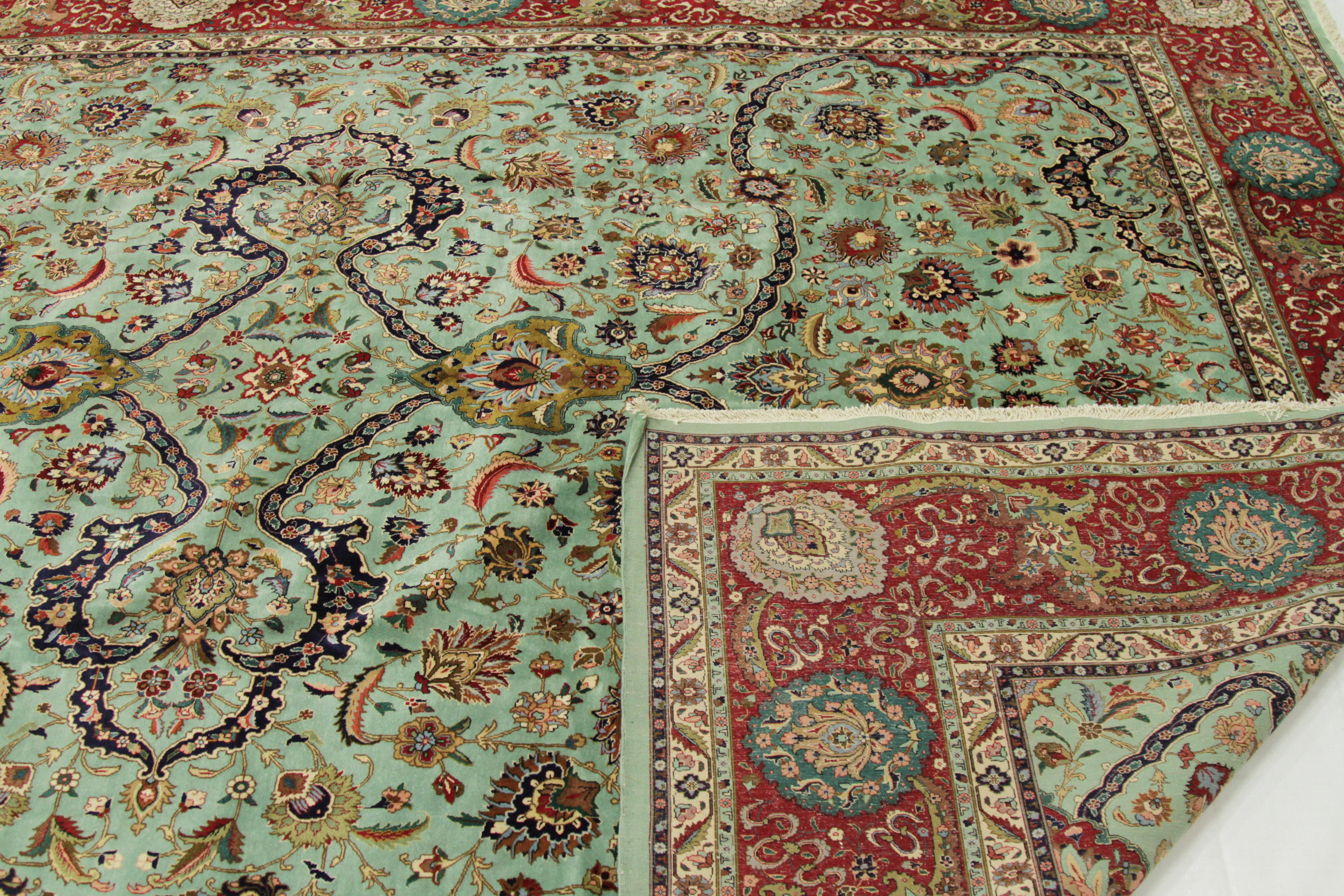 Wool 1970s Antique Tabriz Persian Rug with a Grand Blue and Red Floral Design For Sale