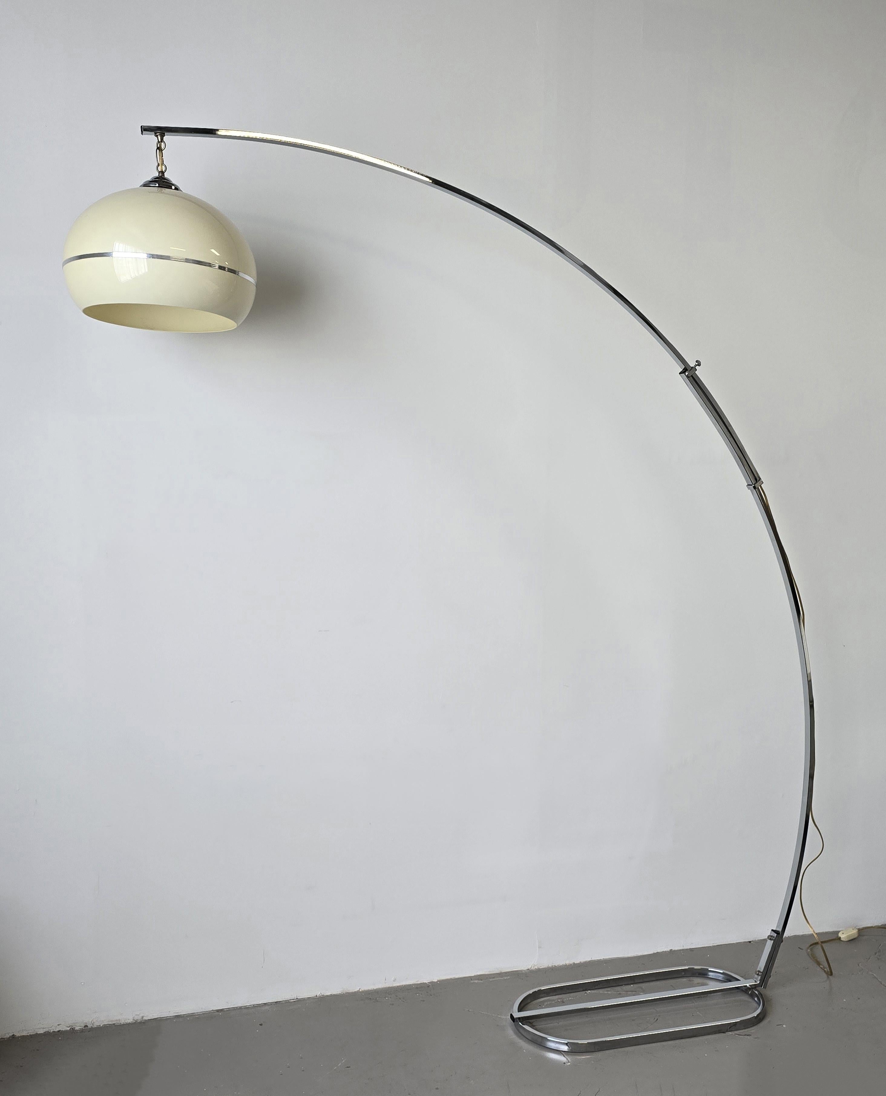 Stunning space age chrome and acrylic arched extendable floor lamp, made in the 1970s. This amazing space age style lamp is crafted with precision, featuring a chrome body with an acrylic shade. It features an arched shape which is extendable and