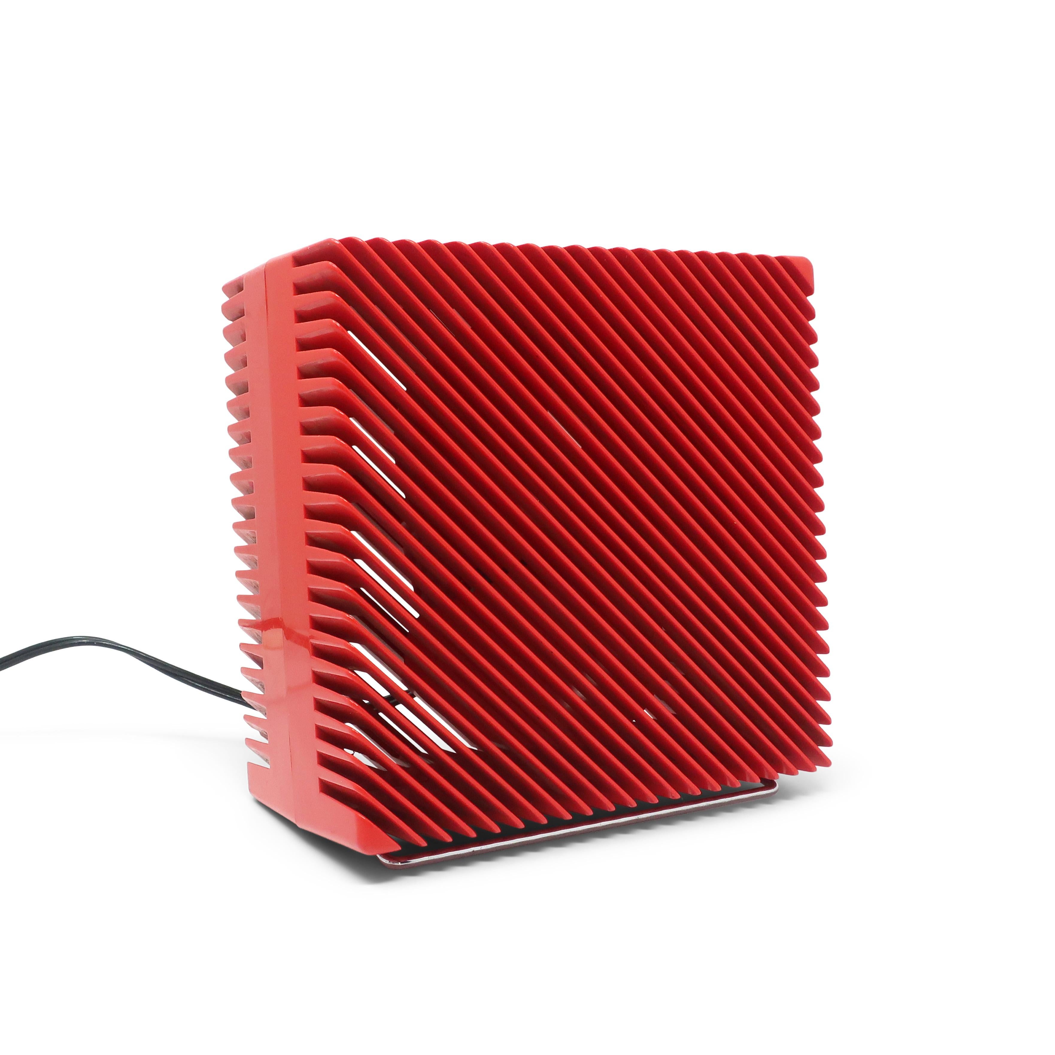 An icon of 1970s radical and early postmodern Italian design, the Ariante fan takes the normally boring square box fan to new design heights.  With 45 degree diagonal slats on a bright red plastic case, an ingenious chrome stand for adjusting the