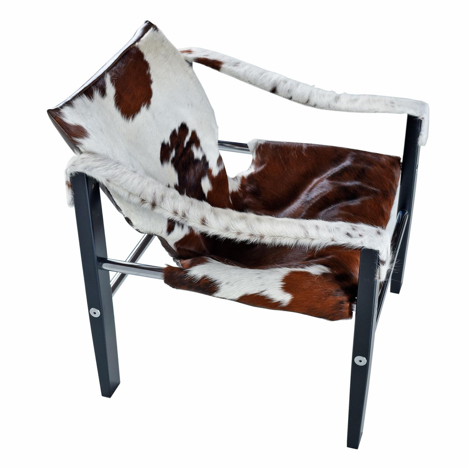 Our restoration team has raised the bar for the Safari chair. Not only did we go with new, authentic cowhide leather, but the frame has been repainted to match the original black satin finish. The fuzzy hide arm slings finish off the look and help