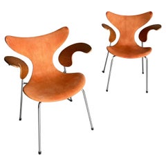 Used 1970s Arne Jacobsen "Lily" armchair , oak / niger leather. 