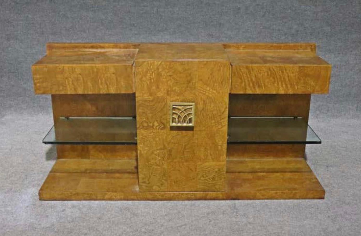 Extraordinary and Incredibly Rare Art Deco Burled Console by Jay Spectre for Century Furniture. Floating Glass Shelves under Cantilevered upper drawers. 

Condition Disclosure:
Please understand nearly all of our inventory is comprised of rare to