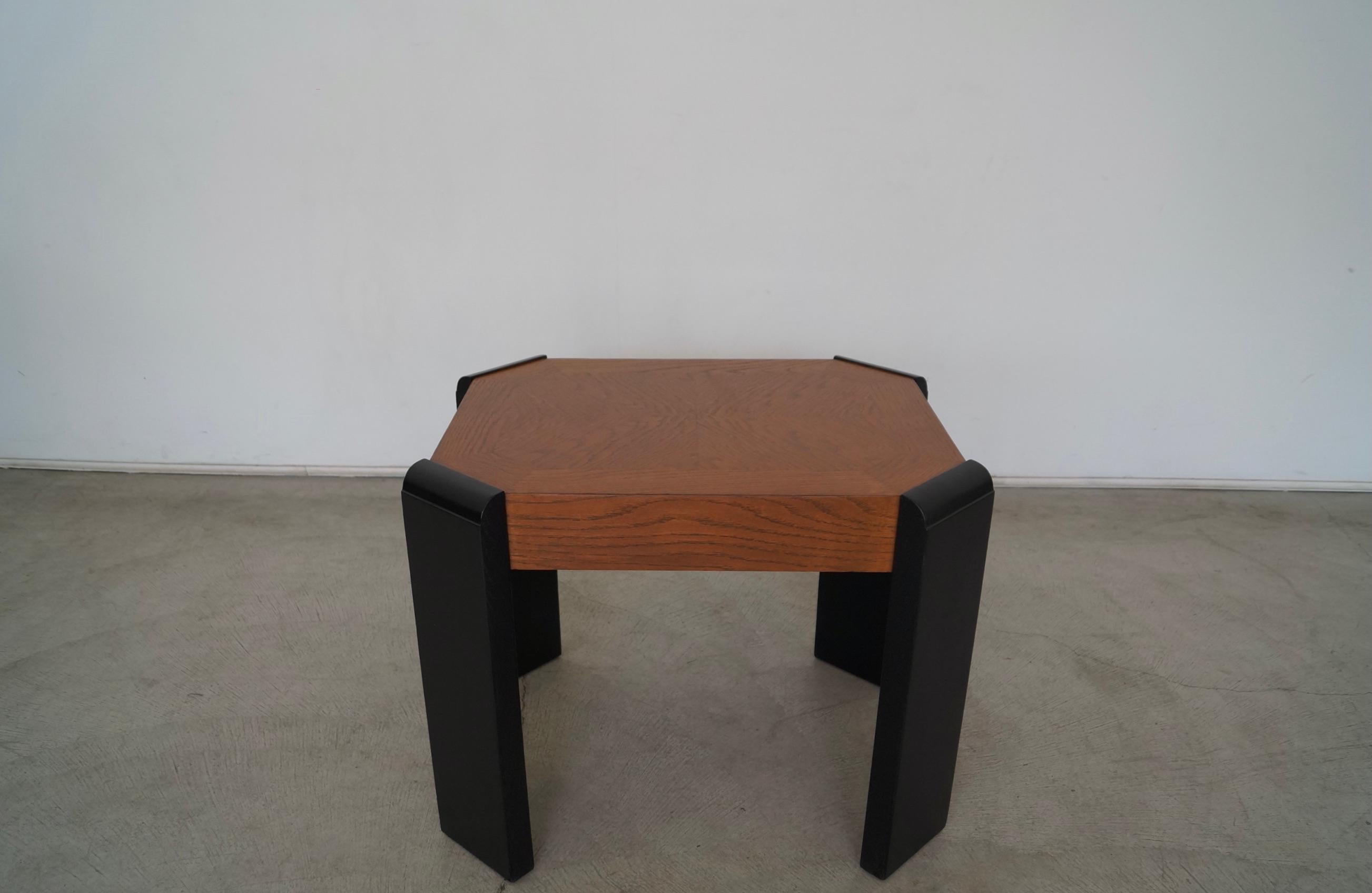 Vintage post-modern end table for sale. From the 1970's, and manufactured by Lane. It has been professionally refinished, and is beautifully restored. It has black finished legs with a walnut finished surface. It's really solid and well made, and