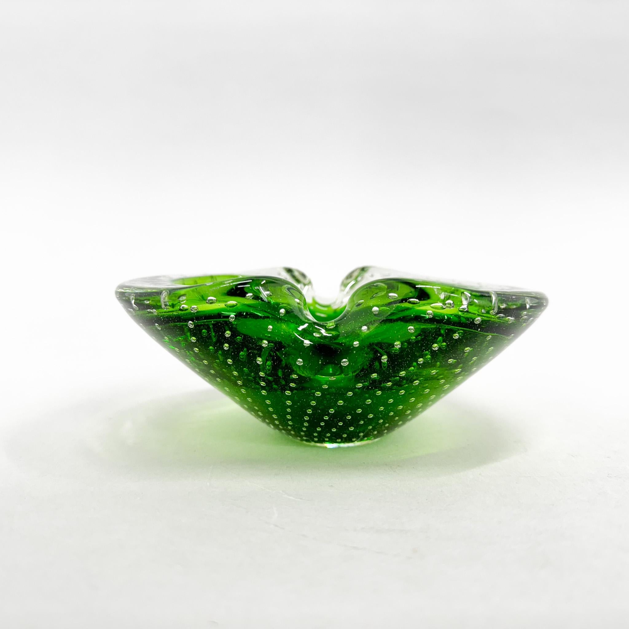 Vintage art glass ashtray, designed by Hana Machovska and produced by Mstisov Glassworks in the former Czechoslovakia in the 1970s. Beautiful green colour with bubbles inside. Good vintage condition with some scratches, that can be seen on the