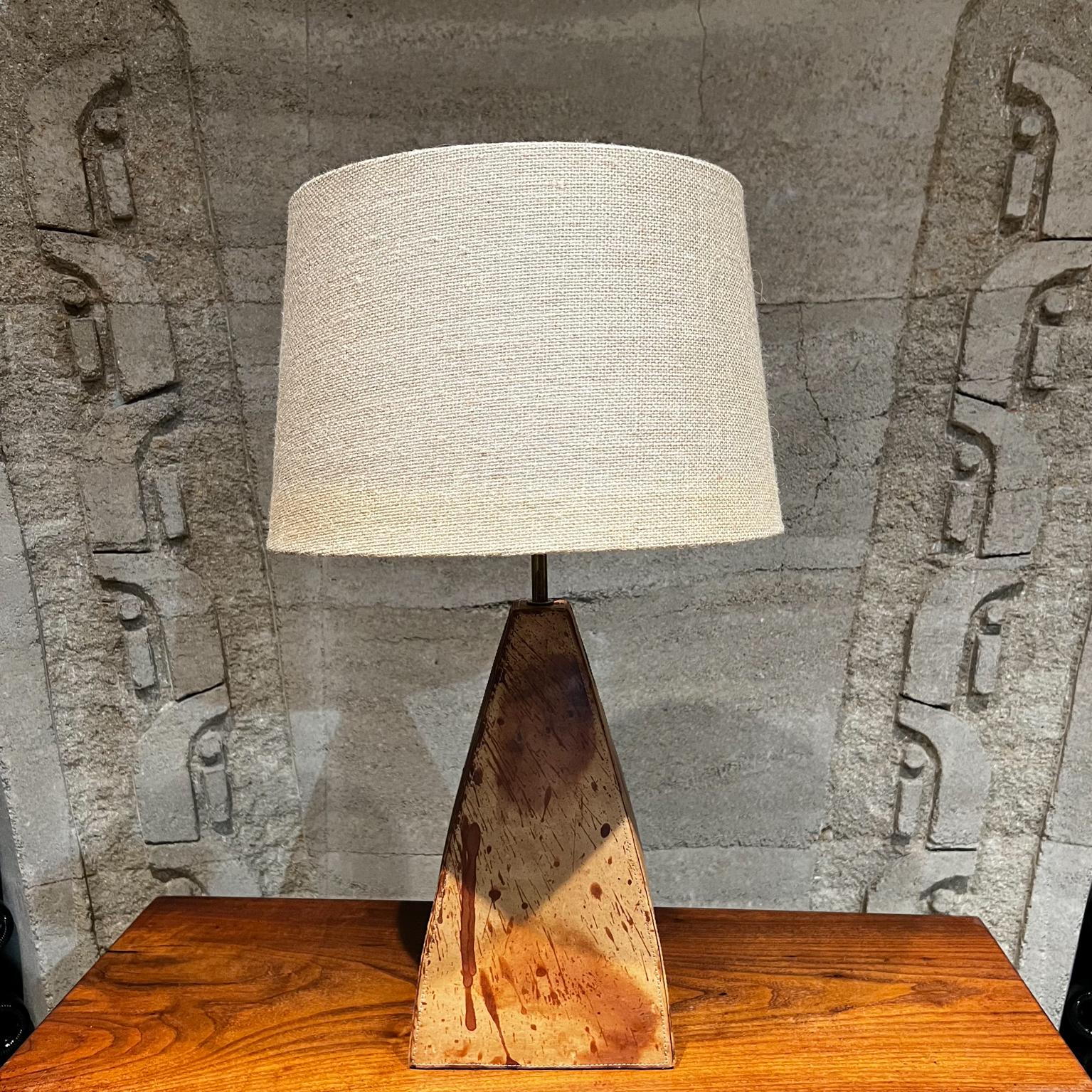 1970s Artistic Table Lamp Modern Design Leather Wrapped with Top Stitching
Approximately 19.75H to socket x 8 x 8
One of a kind table lamp with metal shape frame wrapped in leather.
Leather with vintage patina and beautiful top