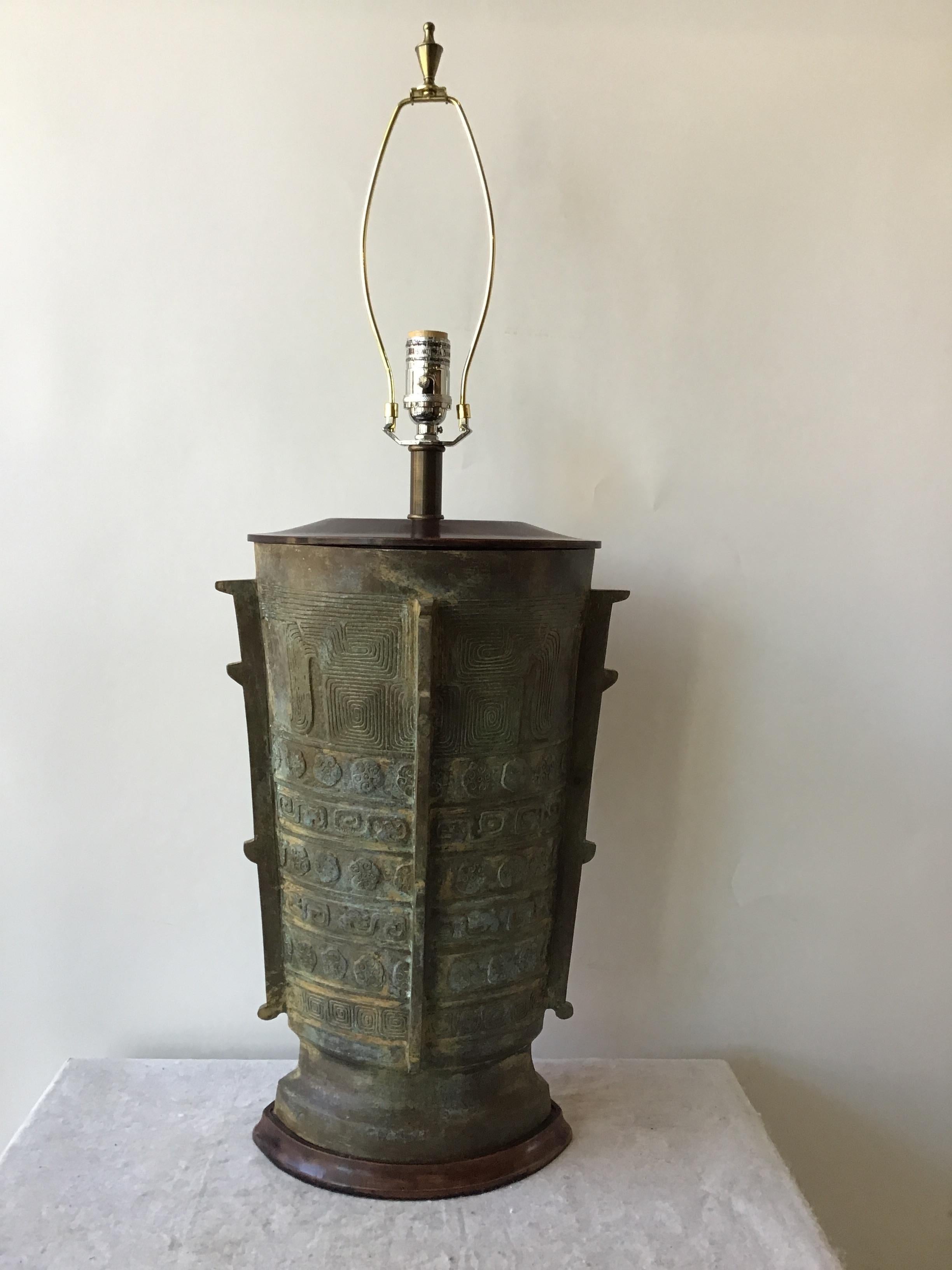 1970s Asian bronze urn lamp. Heavy! Wood base and top. From a Southampton, NY estate.