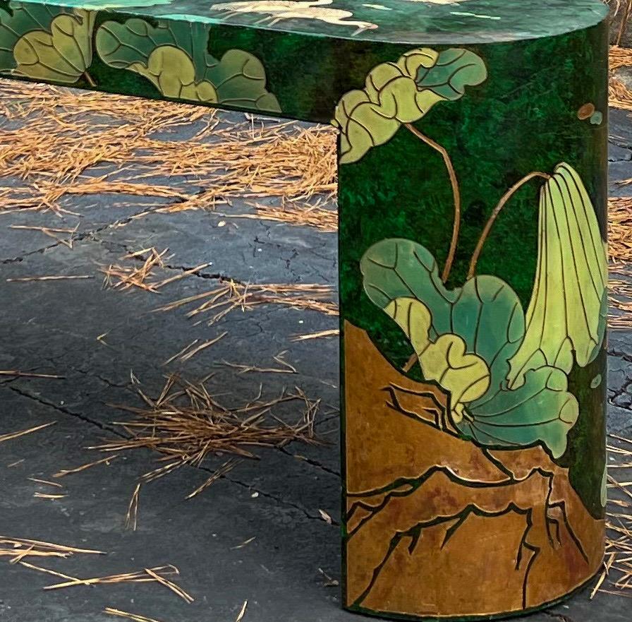 The vivid colors of this! This is an Asian themed console table with a modern form. It is overflowing with cranes and lotus blossoms on a green background. Maitland-Smith has a line that is similar, but it is unmarked.
