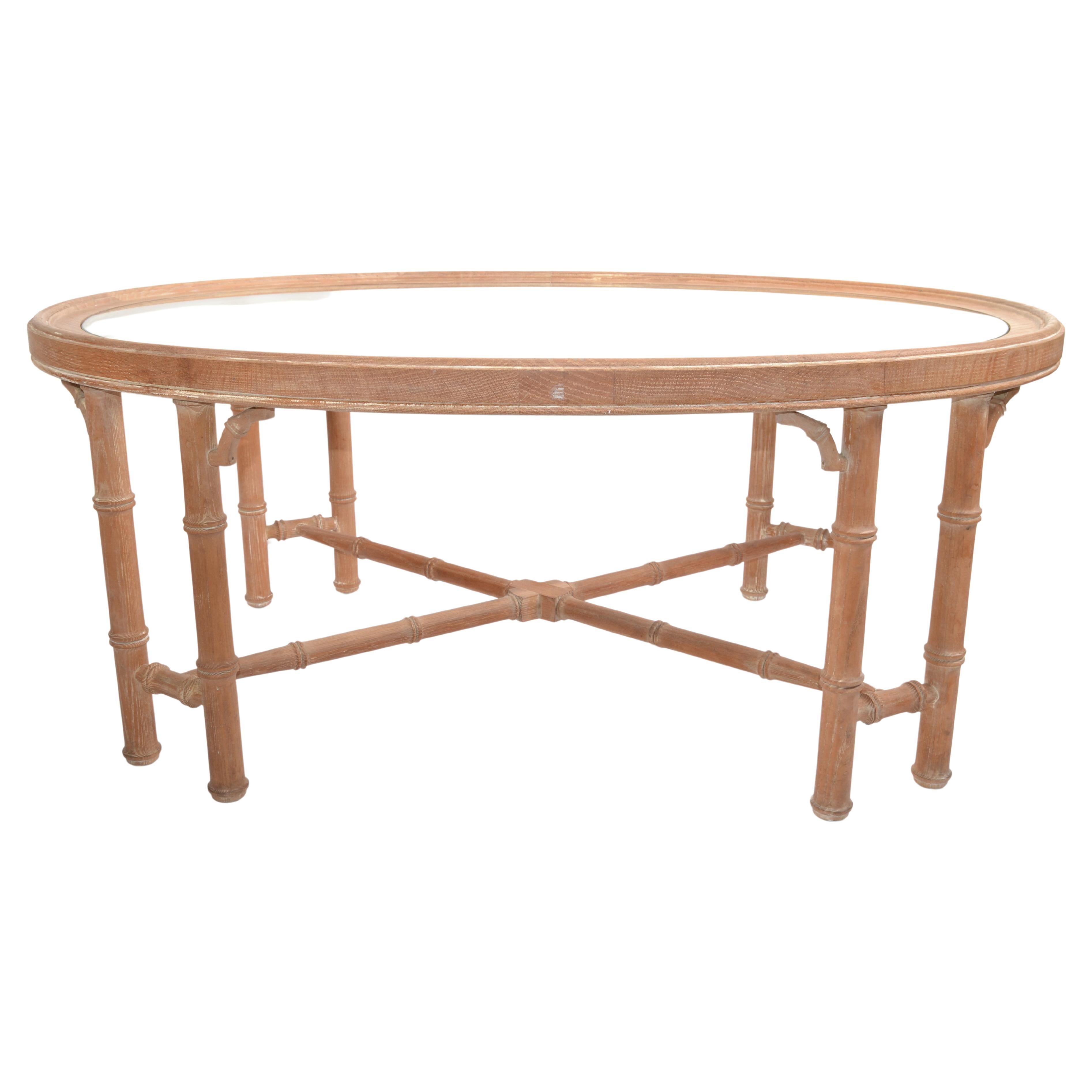 Mid-Century Modern oval white bleached oak wood coffee table with faux bamboo design and oval inserted Glass Top.
Glass measures: 25 x 39 inches.
Lovely 1970s chinoiserie inspired Asian Design Sofa Table which fits to many interior styles.
 