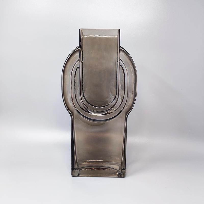 1970s Astonishing beige vase in molded glass by Tamara Aladin. Made In Finland. This vase is in excellent condition.
Dimension:
7.08 x 2.75 x 14.56H inches
cm 18 x cm 7 x cm 34 H.