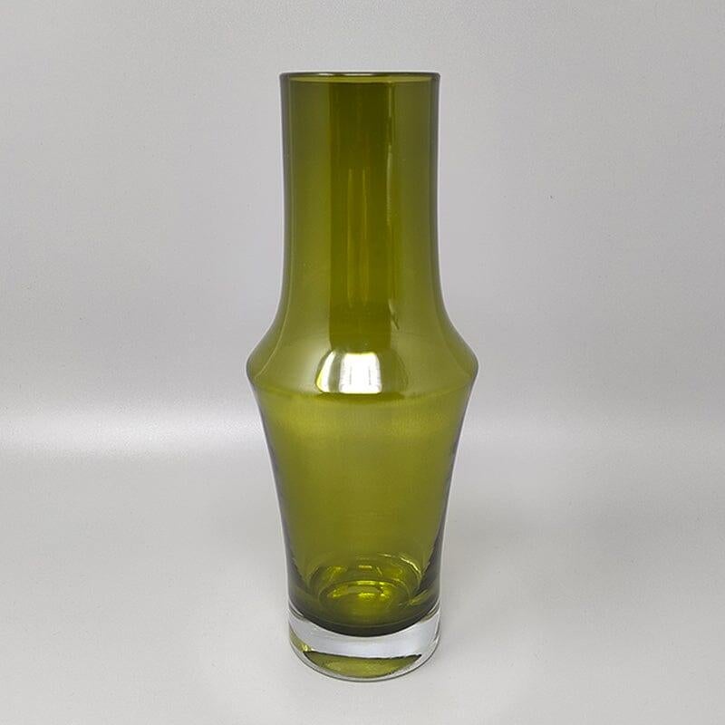 1970s Astonishing green vase #1376 by Tamara Aladin for Riihimaki/Riihimaen Lasi Oy. The item is in excellent condition. Made in Finland. This vase is a sculpture and is part of the history of Scandinavian design. 
Dimension:
diameter 3,54 x 7,87 H