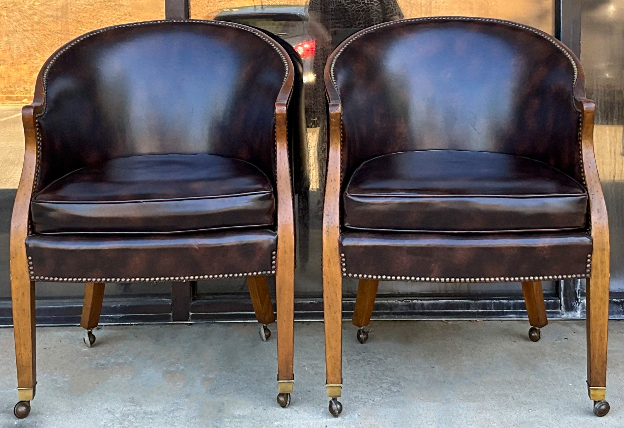 Timeless appeal! This is a pair of vintage leather barrel back tub chairs with brass nail heads and capped feet. The frames are carved fruitwood, and they are marked. They are both in very good condition.
My shipping is for the Continental US only.