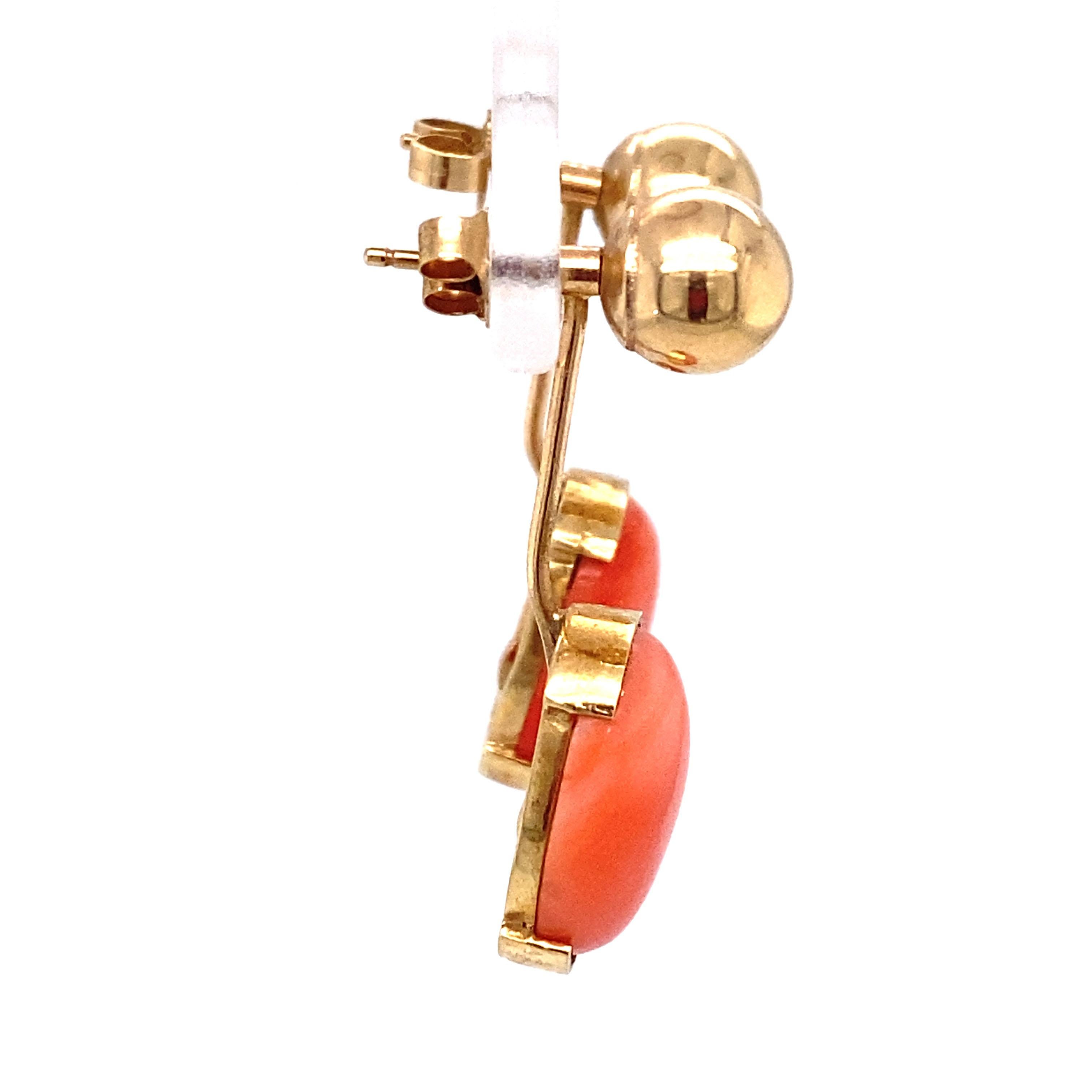 Item Details: These gold earrings have ball studs with dangles of oval coral that are removable.

Circa: 1970s
Metal Type: 14 karat yellow gold
Weight: 4.7 grams
Dimensions: 1 inch Length