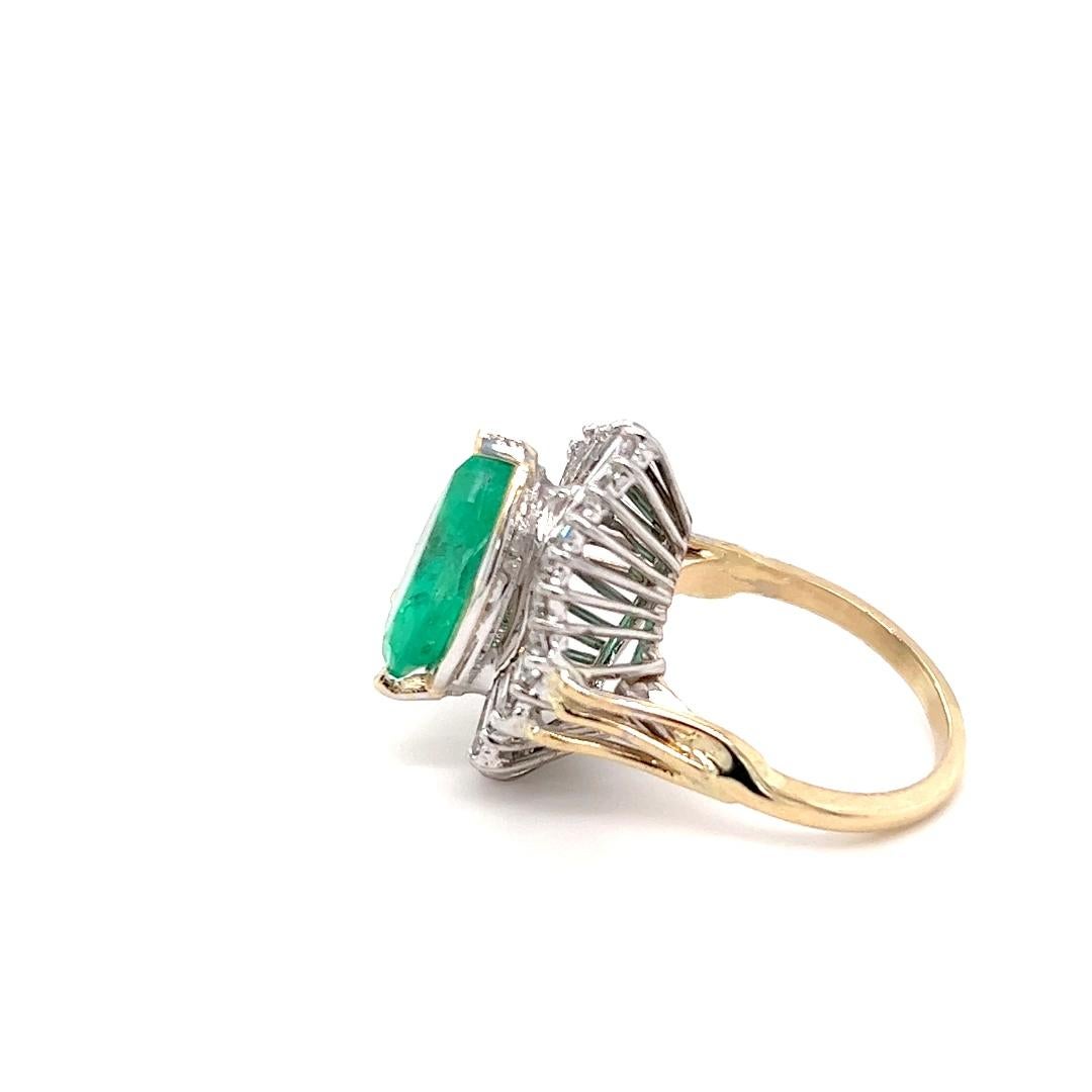 One  14 karat yellow and white gold ballerina style ring set with one natural fine pear-shaped emerald and thirty (30) tapered baguette diamonds, approximately 1.00 carat total weight with matching G/H color and VS clarity. The ring is a finger size