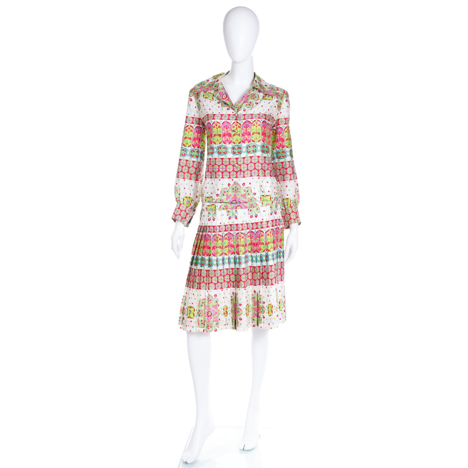 This lovely Boutique Balmain two-piece ensemble dates back to the 1970s. Made from luxurious Thai silk, the set includes a button-front long sleeve blouse and a pleated skirt, both showcasing a vibrant and multi-colored mixed pattern print.

During