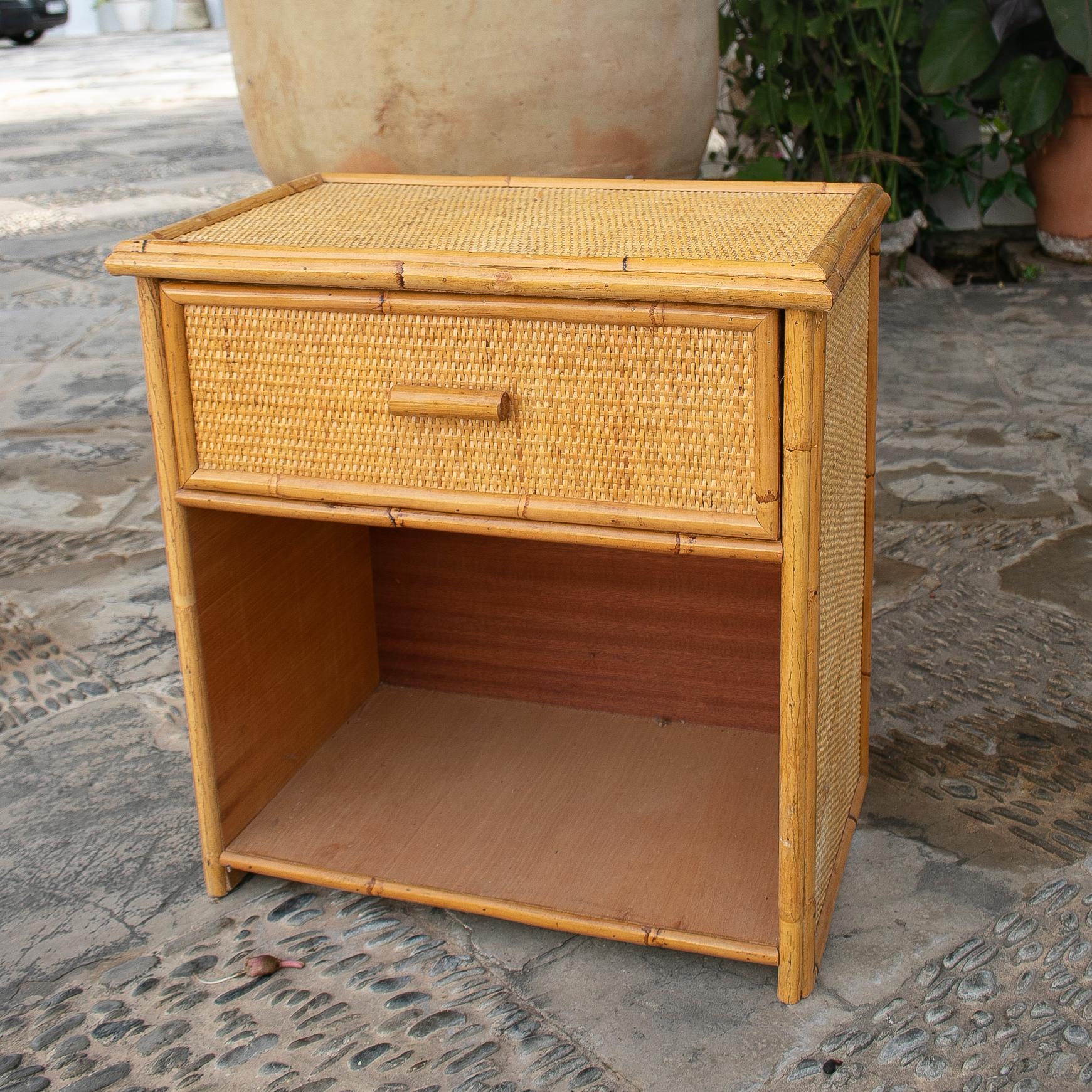 1970s Spanish bamboo and rattan bedside table with drawers.
