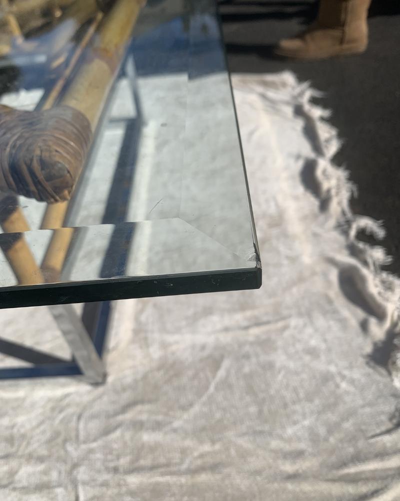 Milo Baughman Style Bamboo Rattan Chrome Glass Coffee Table.

Elevate your living space with this stunning Milo Baughman style bamboo rattan chrome glass coffee table. This vintage piece combines the natural beauty of rattan with the sleek elegance